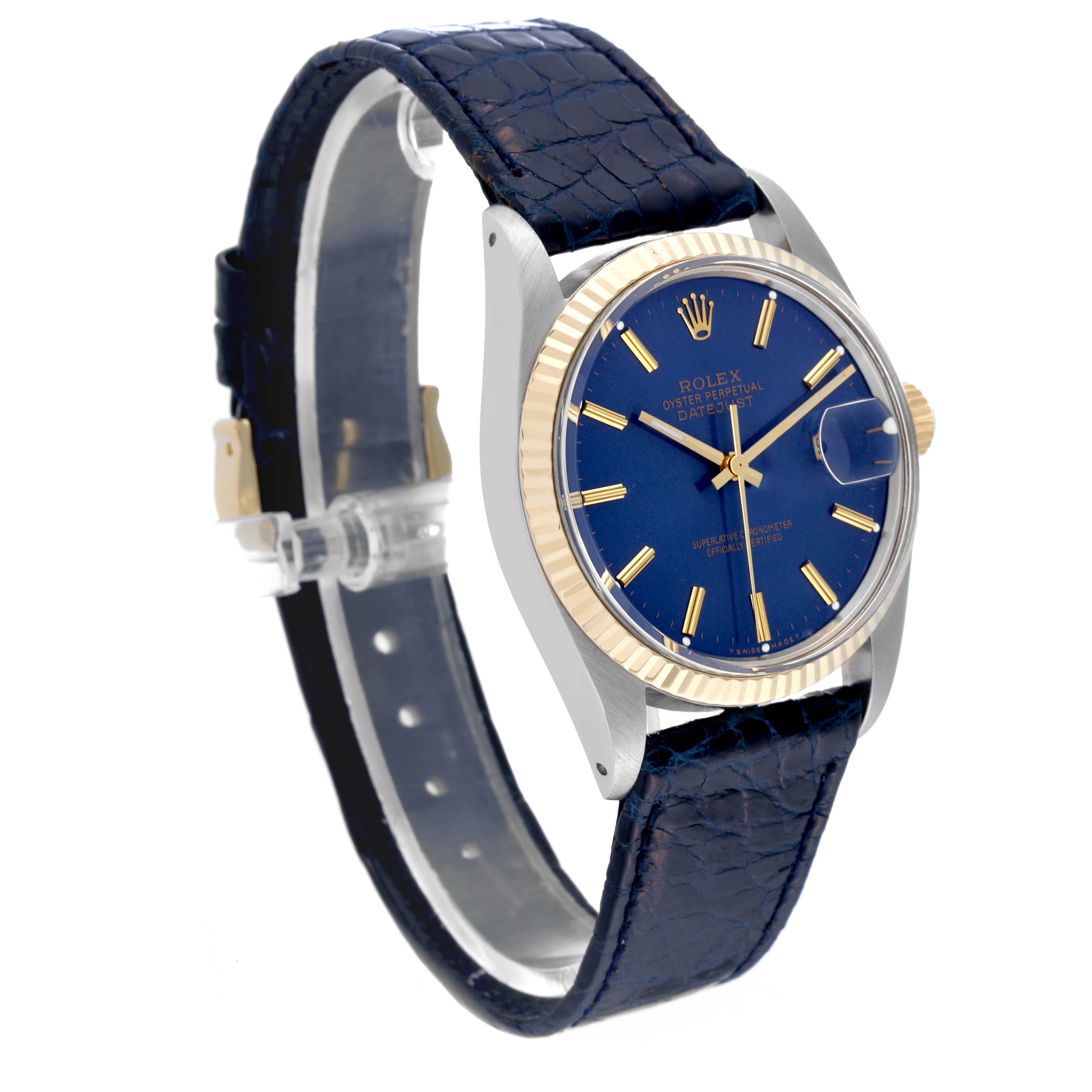 The Rolex Vintage Collection 16013 Men's Steel and Gold (two tone) Blue Dial 16013 Men's Steel and Gold (two tone) Blue Dial watch is shown at an angle displaying its blue dial, gold fluted bezel, and blue leather strap.