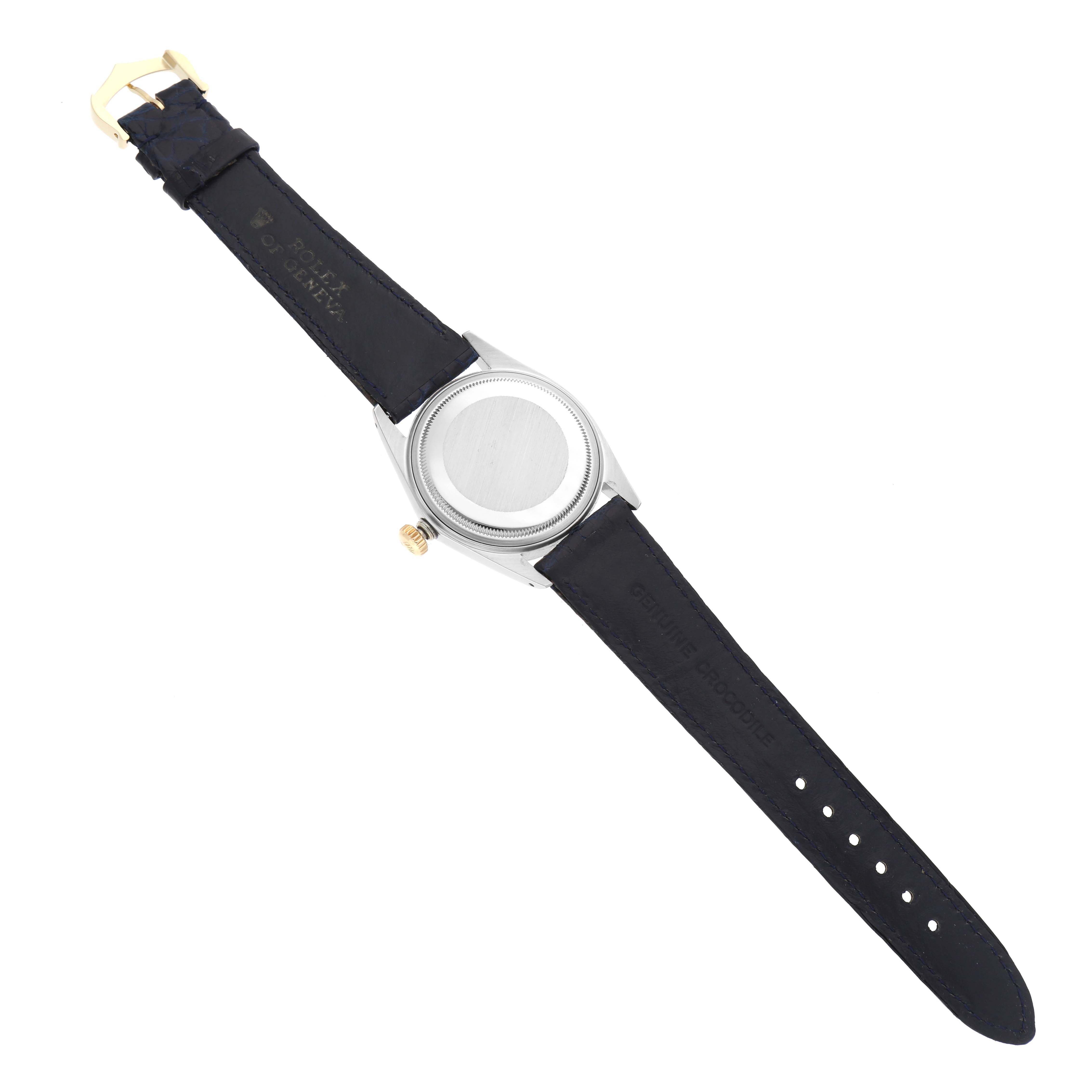 The image shows the back view of a Vintage Collection Rolex watch with its leather strap and buckle visible.