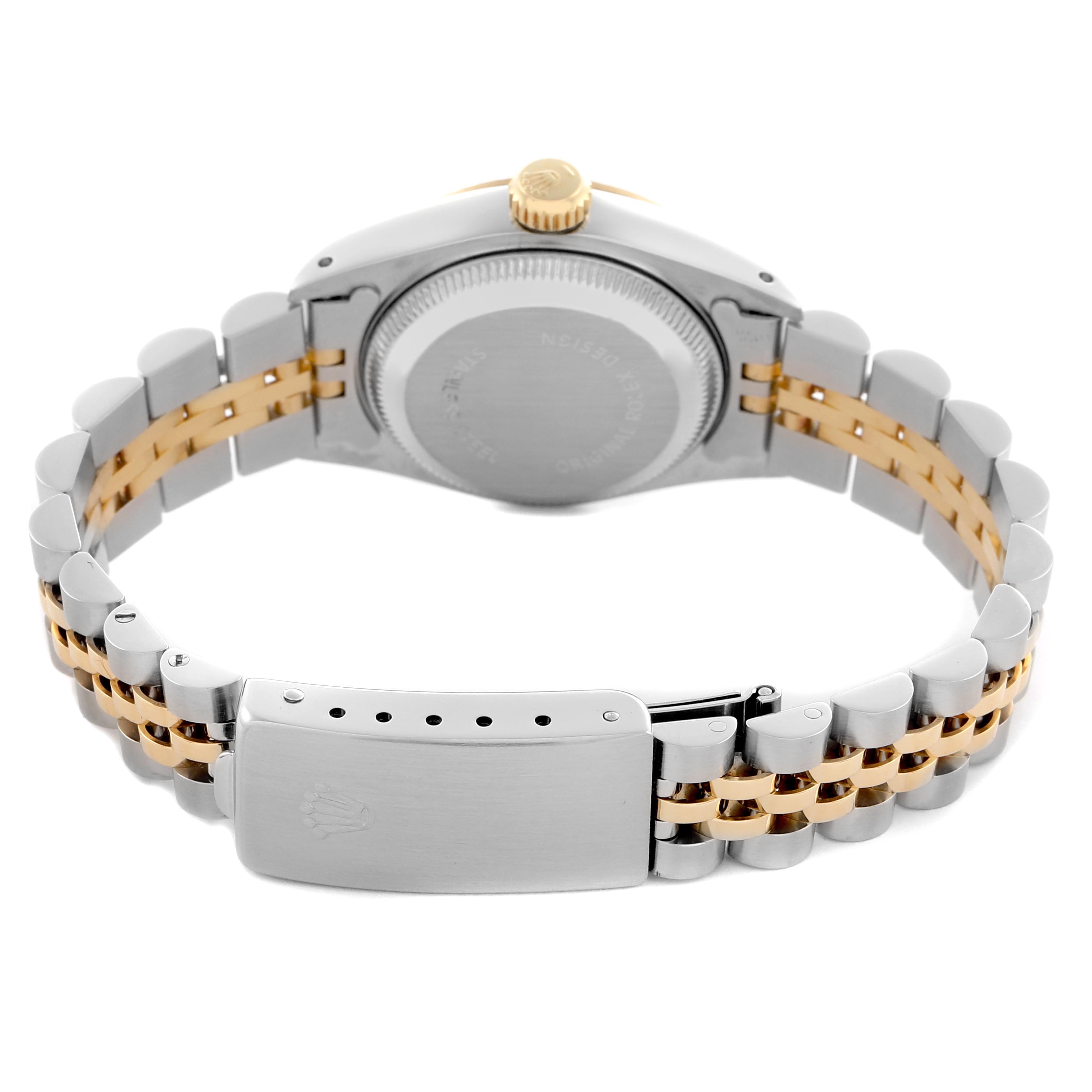 The image shows the back of the Rolex Datejust 69173 Women's Steel and Gold (two tone) Champagne Dial 69173 Women's Steel and Gold (two tone) Champagne Dial with a focus on the case back, crown, and two-tone bracelet.