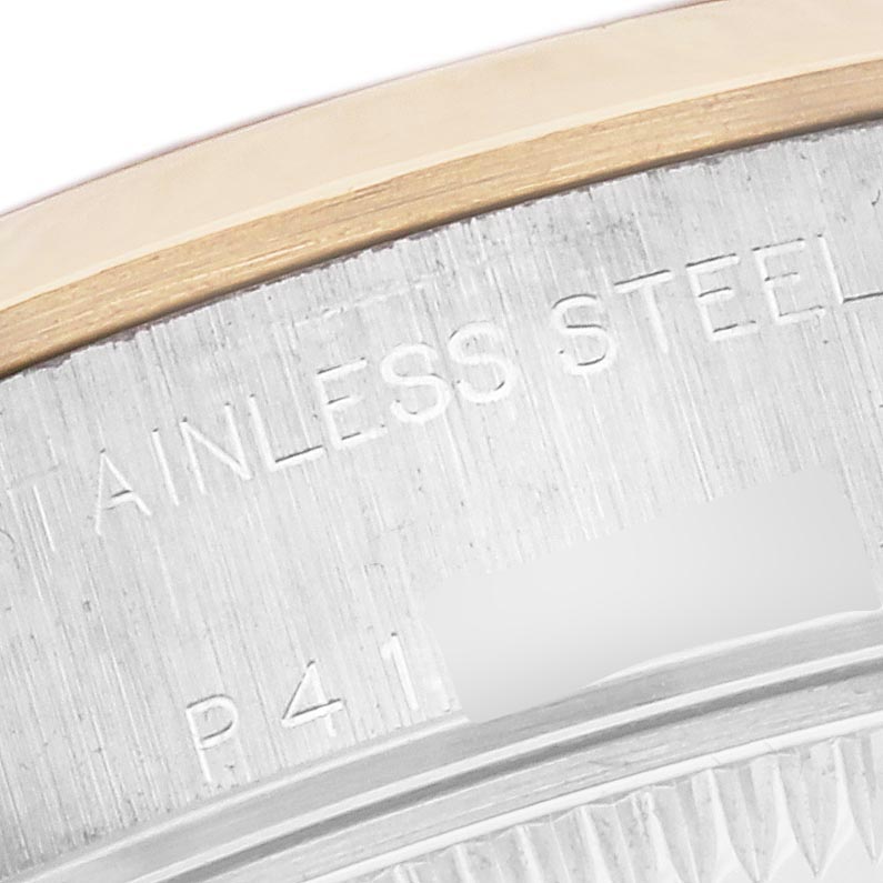 The image shows a close-up of the side edge of the Rolex Datejust 79163 Women's Steel and Gold (two tone) Grey Dial 79163 Women's Steel and Gold (two tone) Grey Dial watch, highlighting the stainless steel bezel.