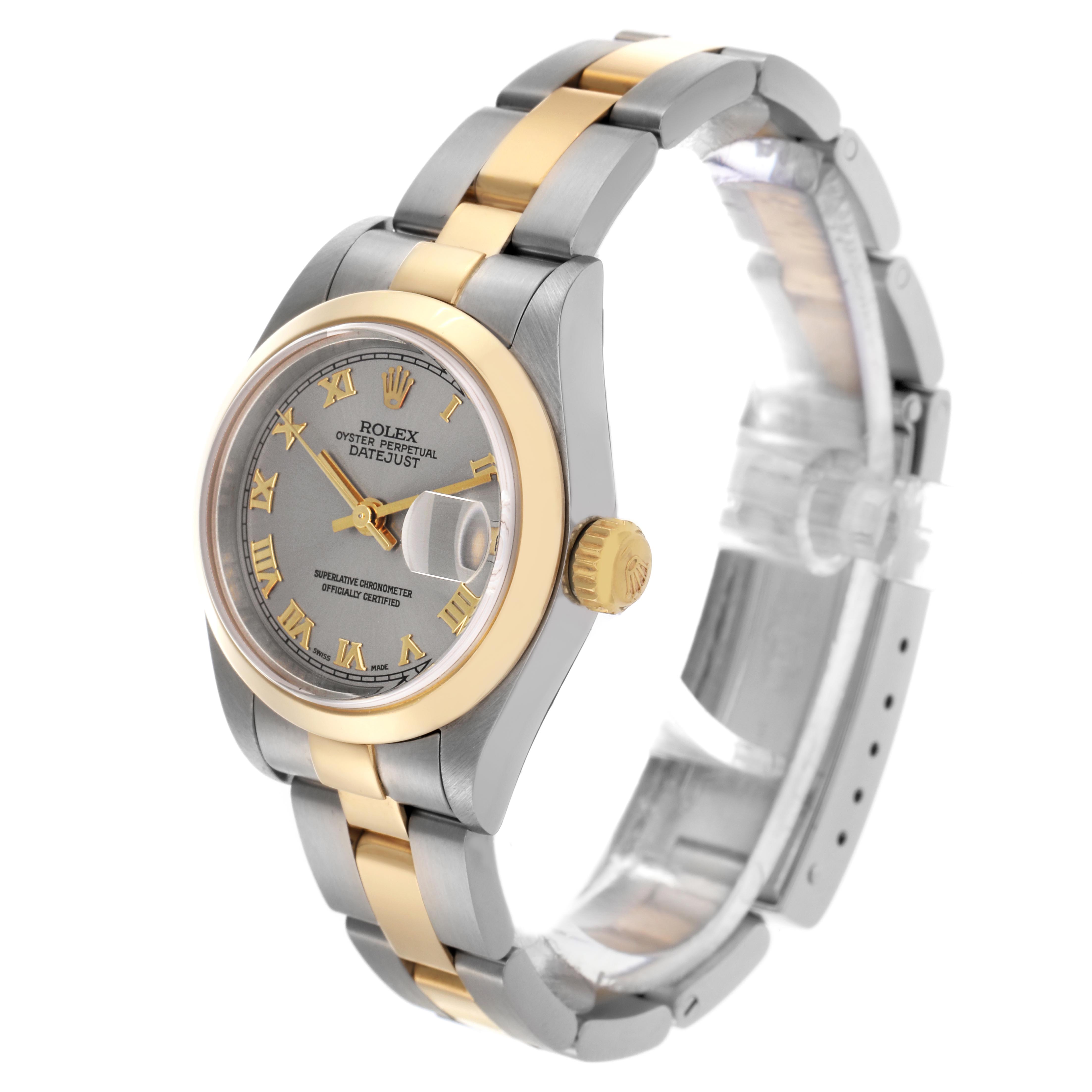 The Rolex Datejust 79163 Women's Steel and Gold (two tone) Grey Dial 79163 Women's Steel and Gold (two tone) Grey Dial watch is shown at a three-quarter angle, highlighting the dial, bezel, crown, and two-tone bracelet.