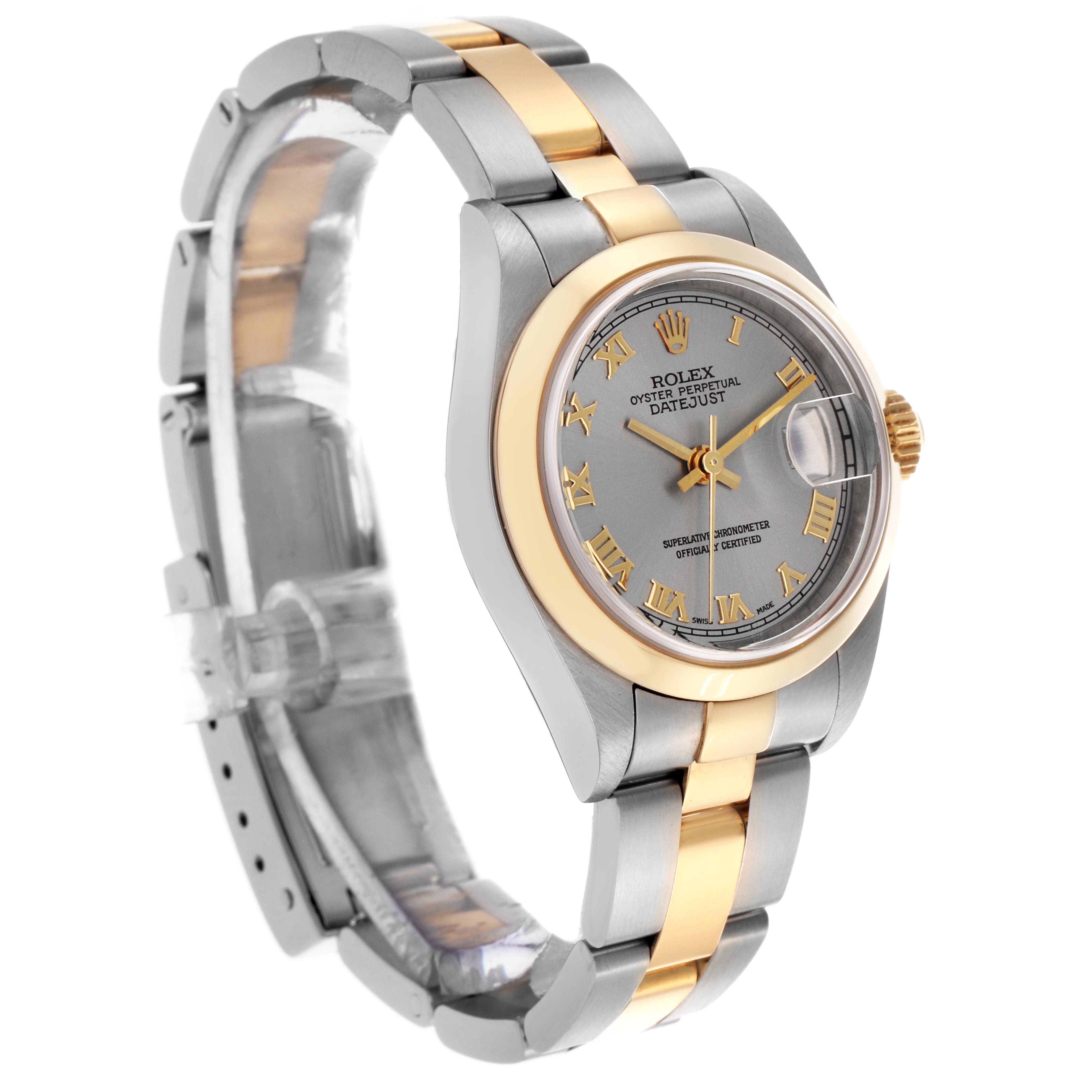 The Rolex Datejust 79163 Women's Steel and Gold (two tone) Grey Dial 79163 Women's Steel and Gold (two tone) Grey Dial watch is shown at a slight angle, highlighting the gold and silver bracelet, case, and Roman numeral dial.