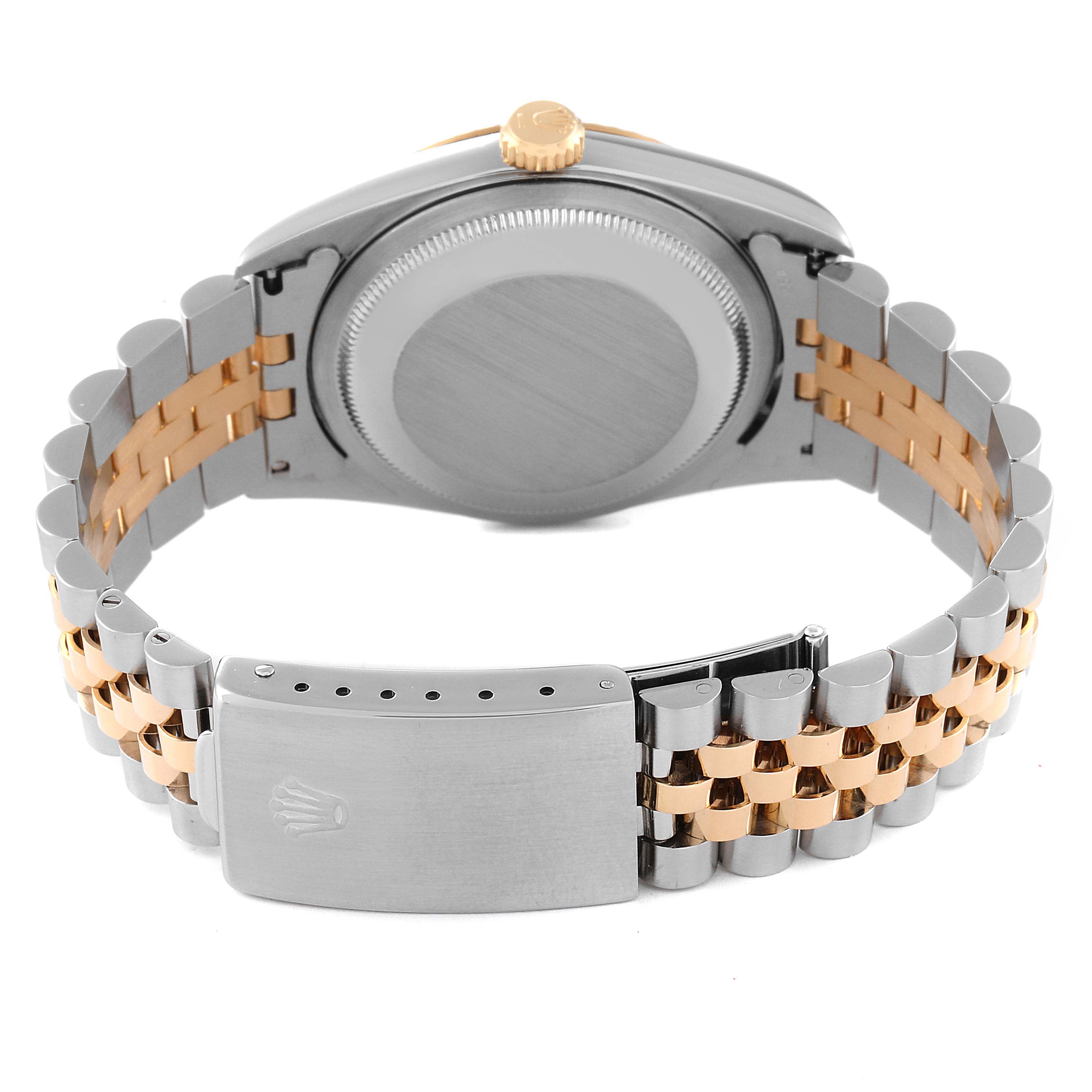 The image shows the back view of a Rolex Datejust 16233 Men's Steel and Gold (two tone)  16233 Men's Steel and Gold (two tone)  watch, highlighting the case back and the bracelet with a two-tone metal clasp.