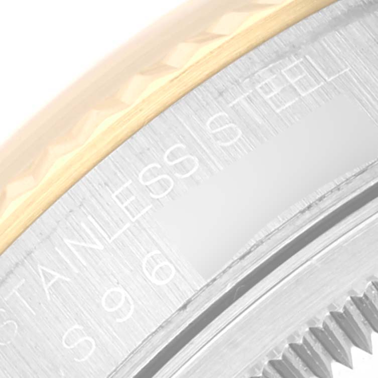 This image shows a close-up of the Datejust Rolex watch, focusing on the stainless steel and gold bezel.