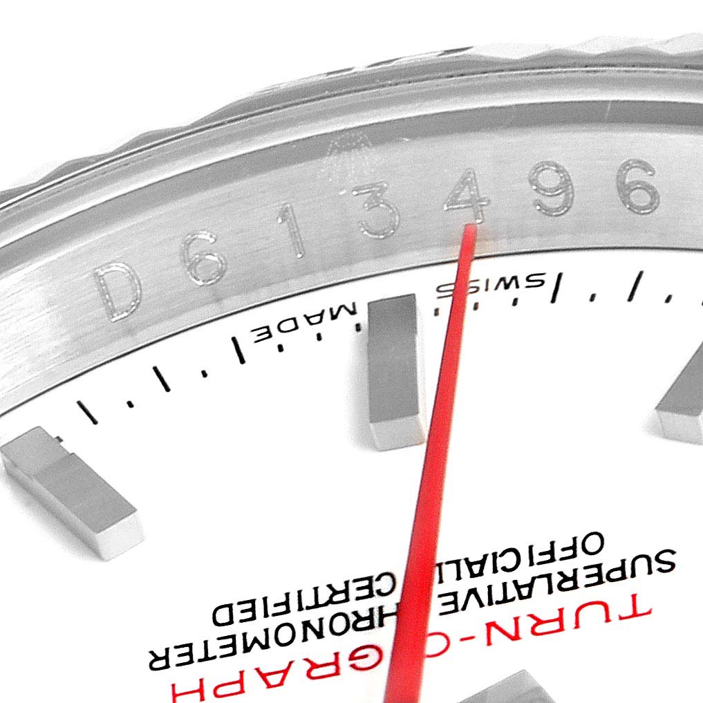The image shows a close-up of the Rolex Turn-o-Graph 116264 Men
s Stainless Steel White Dial 116264 Men
s Stainless Steel White Dial watch face, focusing on the bezel, part of the dial, and the serial number.