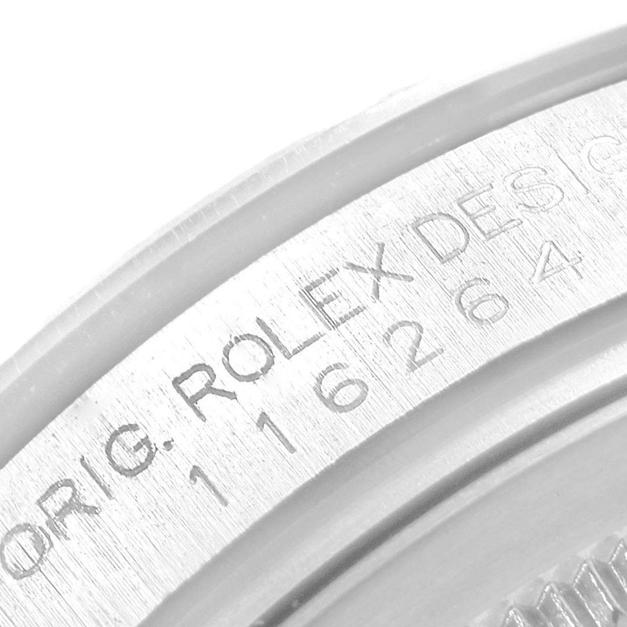 This image shows a close-up of the serial number engraving on the side of the bezel of a Rolex Turn-o-Graph 116264 Men
s Stainless Steel White Dial 116264 Men
s Stainless Steel White Dial watch.