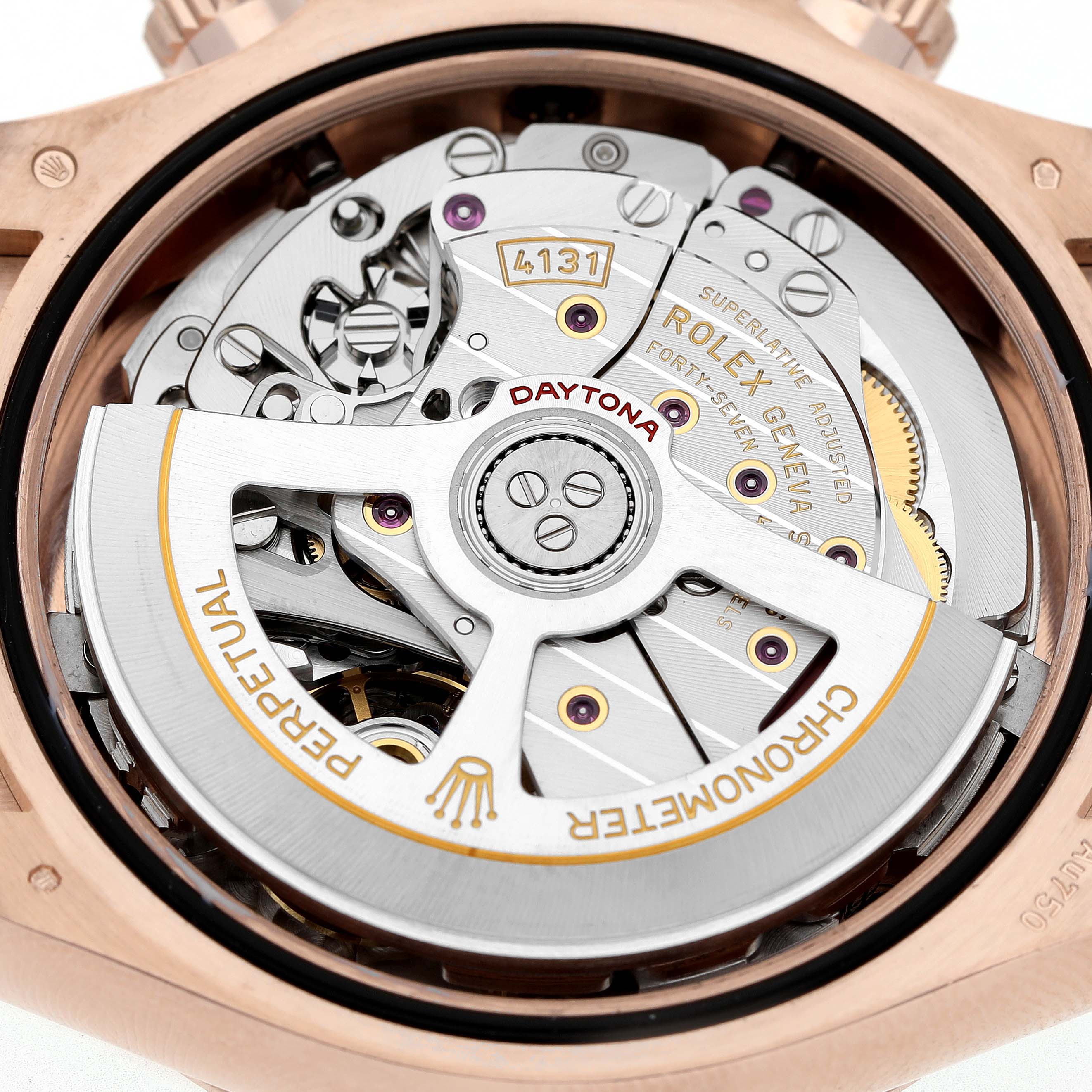 The image shows the movement of a Rolex Daytona 126515LN Men's Rose Gold Black Dial watch, highlighting its internal mechanics and engravings.