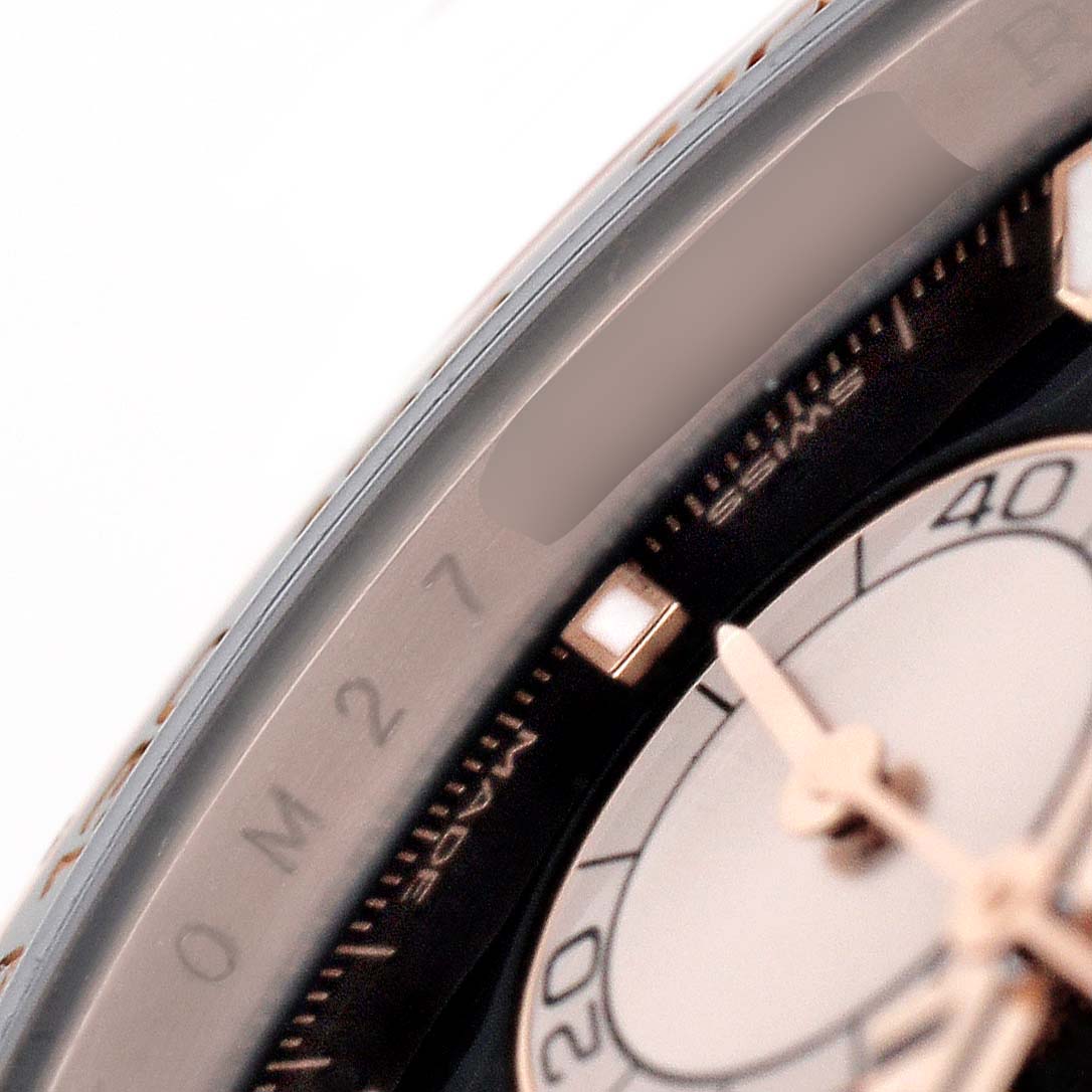 The image shows a close-up of the bezel and part of the dial of a Rolex Daytona 126515LN Men's Rose Gold Black Dial watch, highlighting the chronograph markers.