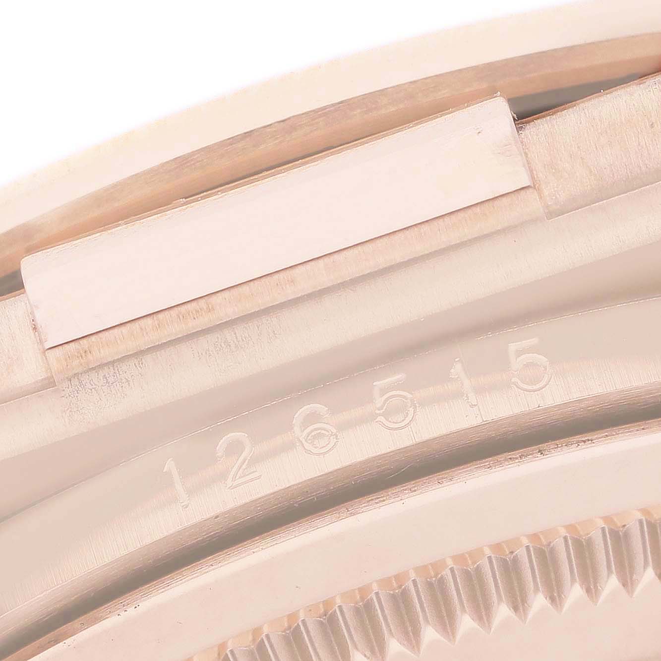 The image shows a close-up of the side of the Rolex Daytona 126515LN Men's Rose Gold Black Dial case, highlighting the model number engraved on its edge.