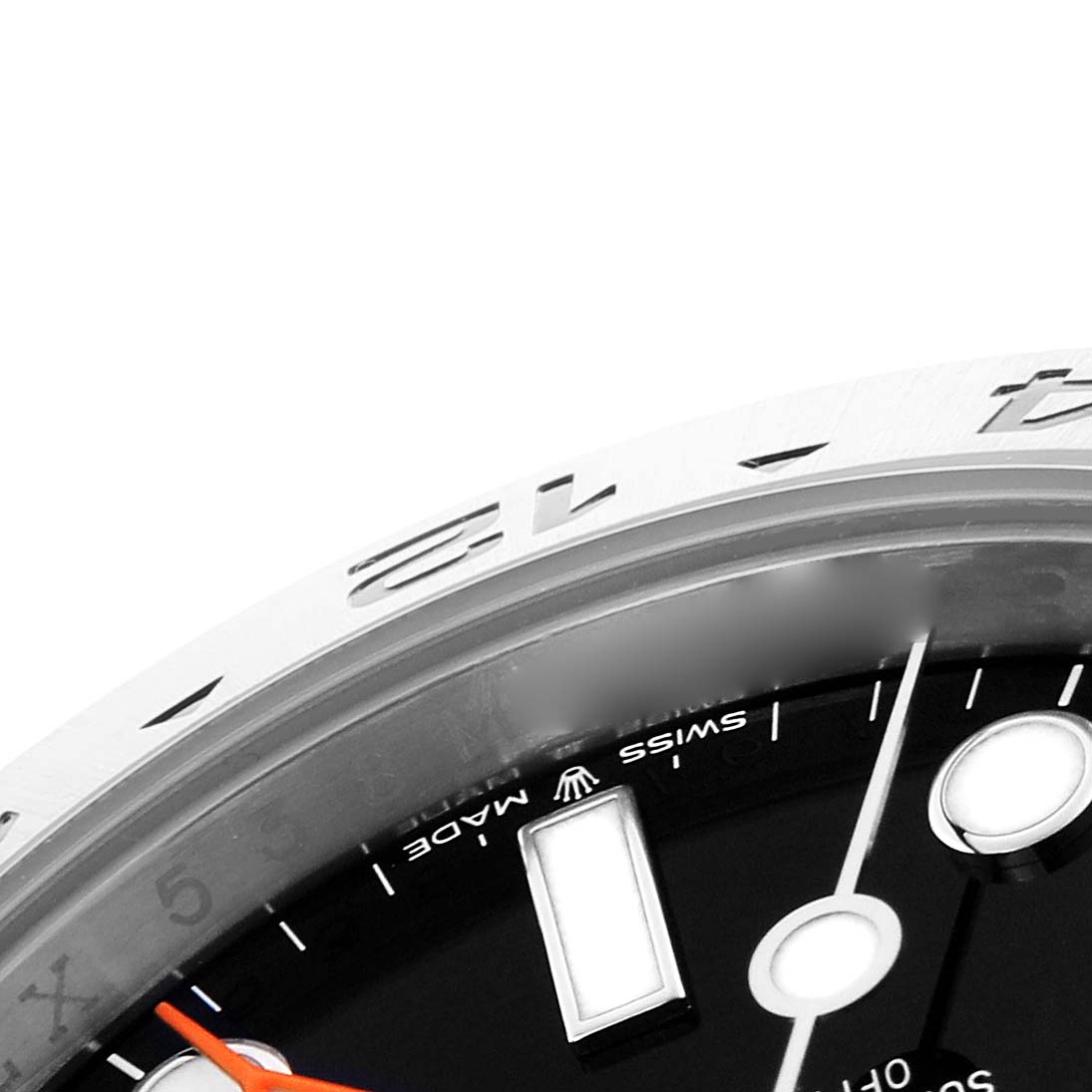 The image shows a close-up of the dial and bezel of a Rolex Explorer 226570 Men's Stainless Steel Black Dial 226570 Men's Stainless Steel Black Dial watch, highlighting parts of the hour markers and hands.