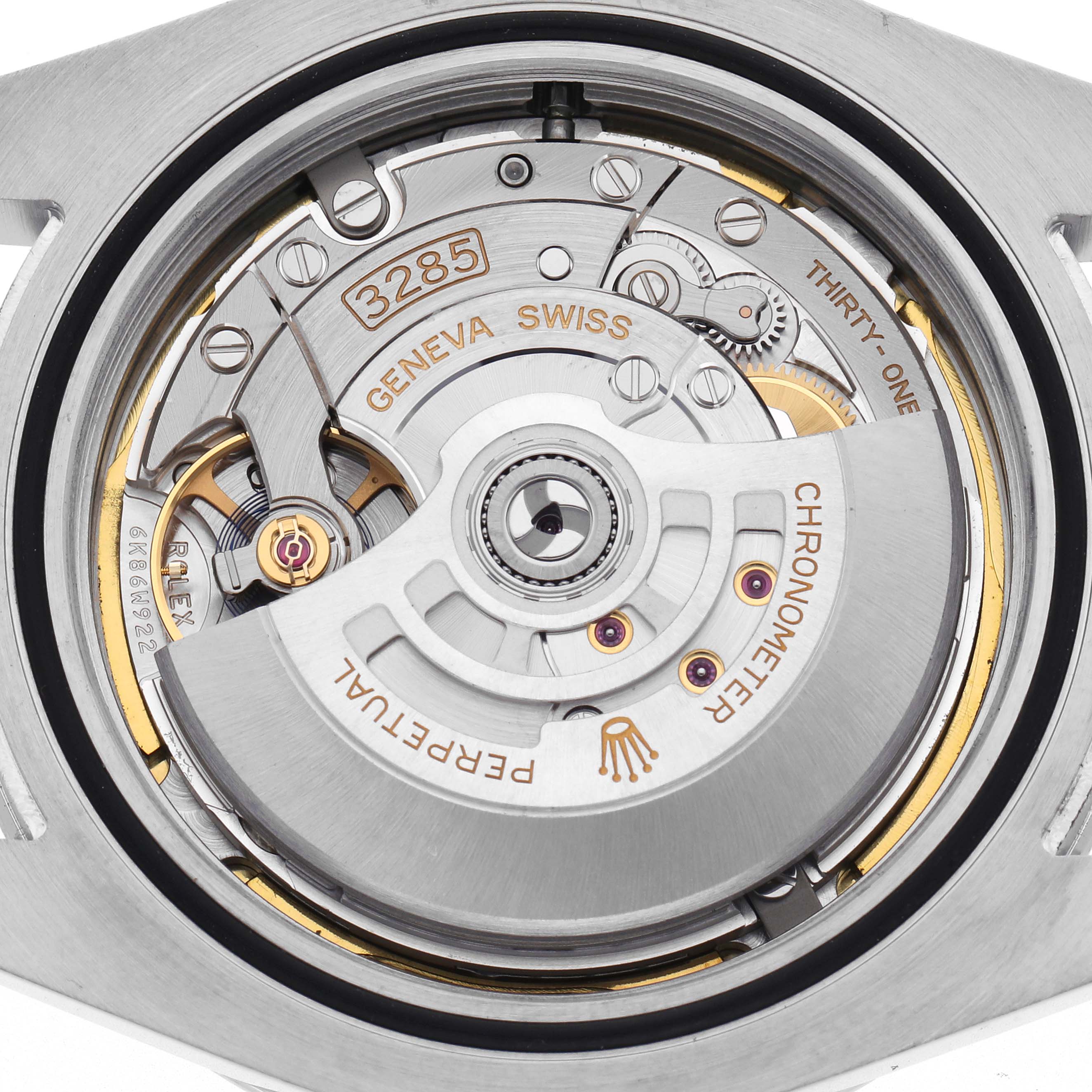 The image shows the Rolex Explorer 226570 Men's Stainless Steel Black Dial 226570 Men's Stainless Steel Black Dial's movement from the back, highlighting the rotor, gears, and inscriptions.