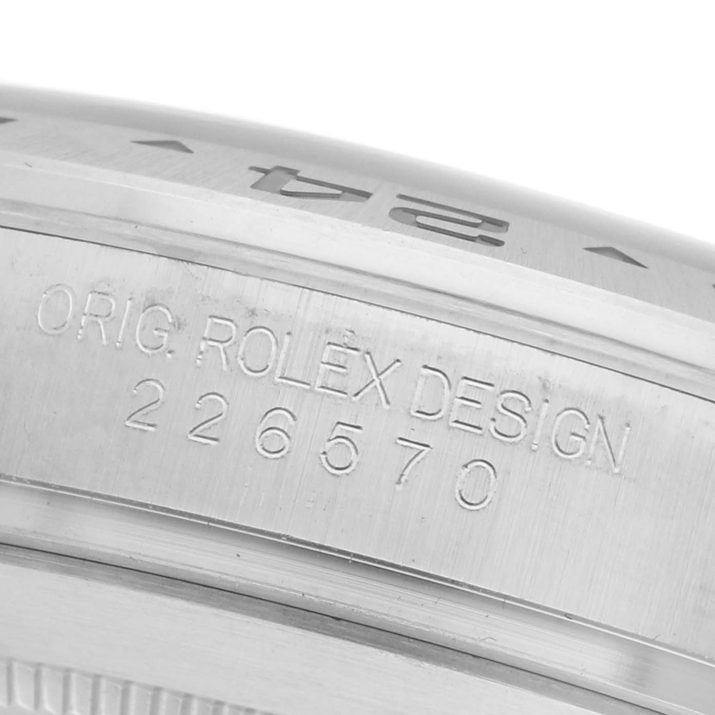 The image shows the side engraving of a Rolex GMT-Master 226570 Men's Stainless Steel Black Dial 226570 Men's Stainless Steel Black Dial model, displaying the words "ORIG. ROLEX DESIGN 226570."