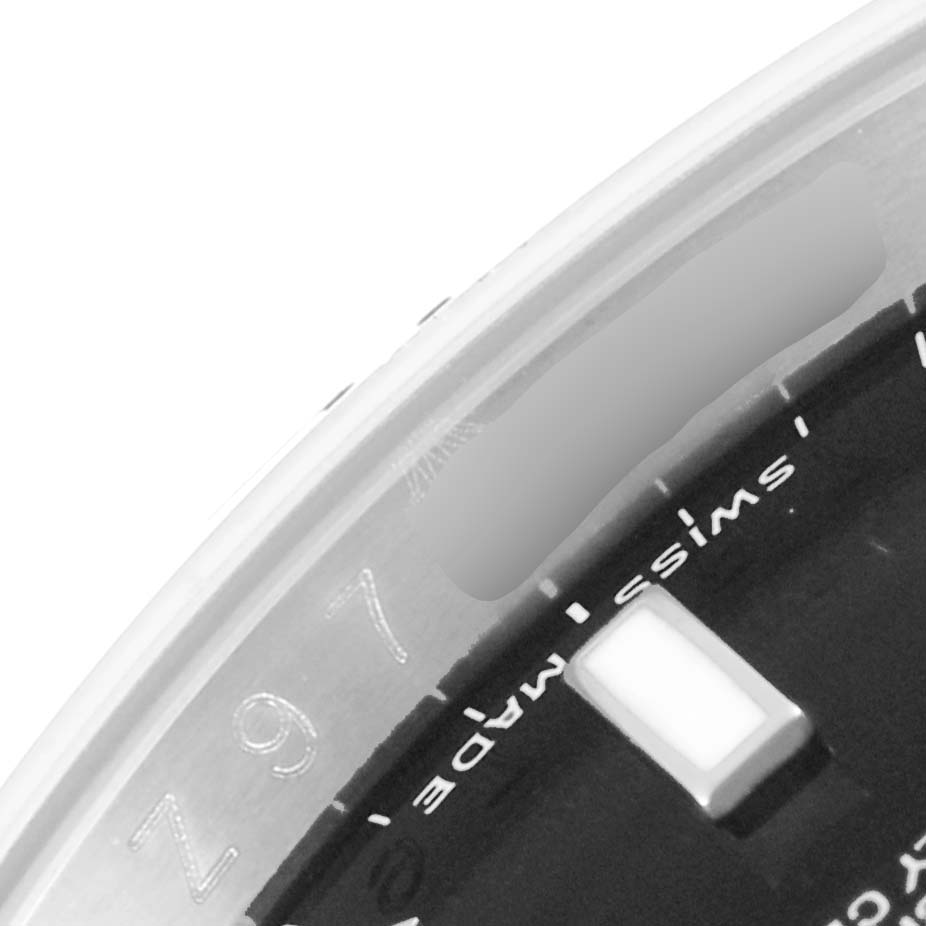 This image shows a close-up of the dial section of a Rolex Explorer 16570 Men's Stainless Steel Black Dial 16570 Men's Stainless Steel Black Dial watch, highlighting the 'Swiss Made' marking and part of the chapter ring.