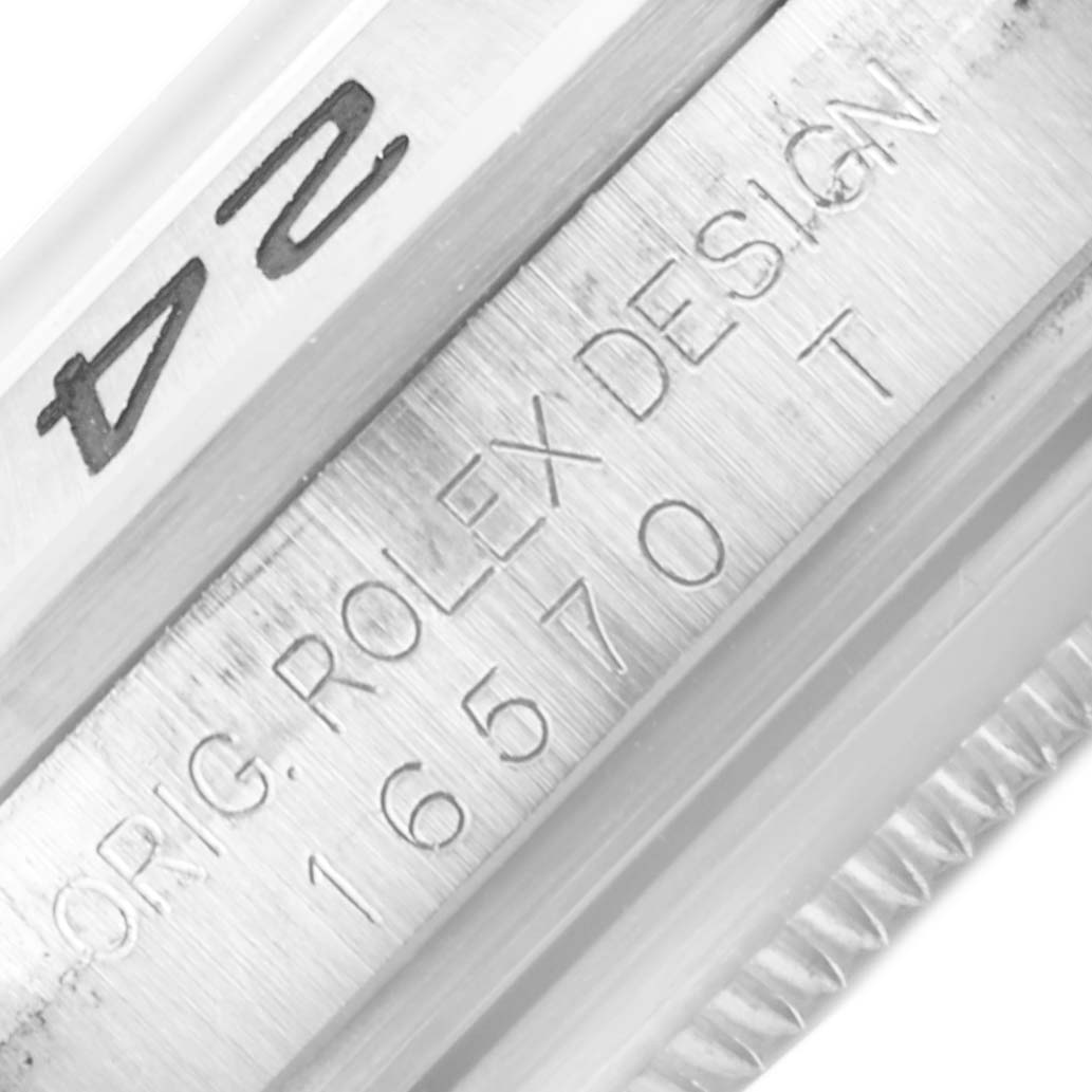 This image shows the side of the Rolex Explorer 16570 Men's Stainless Steel Black Dial 16570 Men's Stainless Steel Black Dial watch case with its engraved model number and branding.