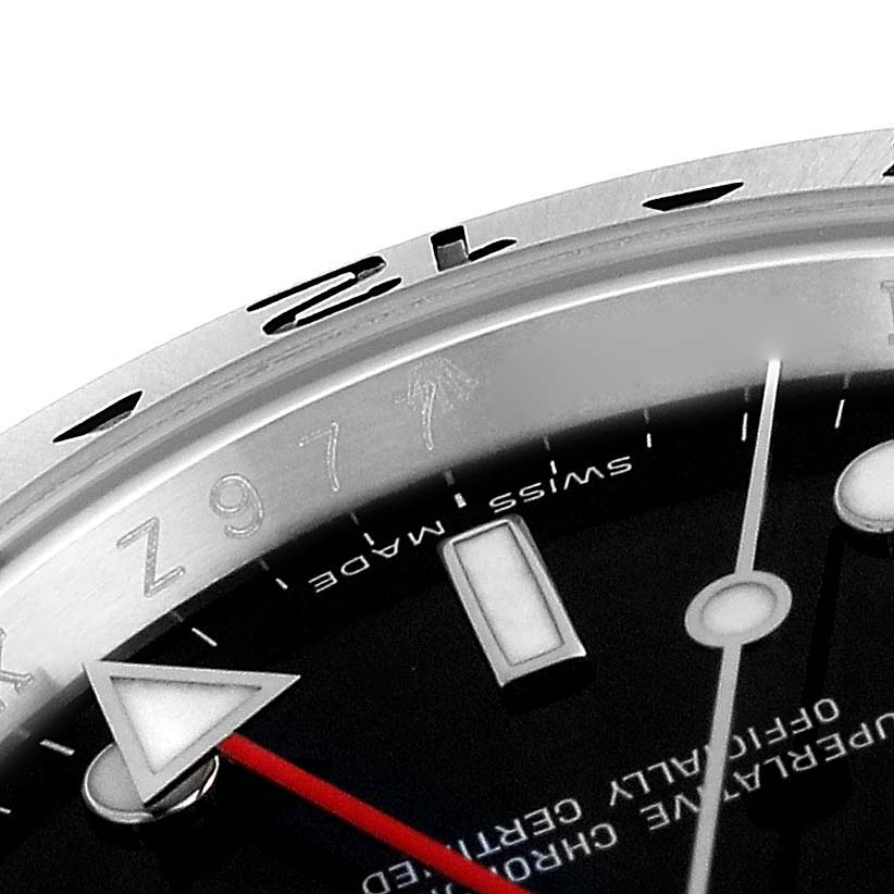 The image shows a close-up of the dial, bezel, and part of the red second hand of the Rolex Explorer 16570 Men's Stainless Steel Black Dial 16570 Men's Stainless Steel Black Dial watch.