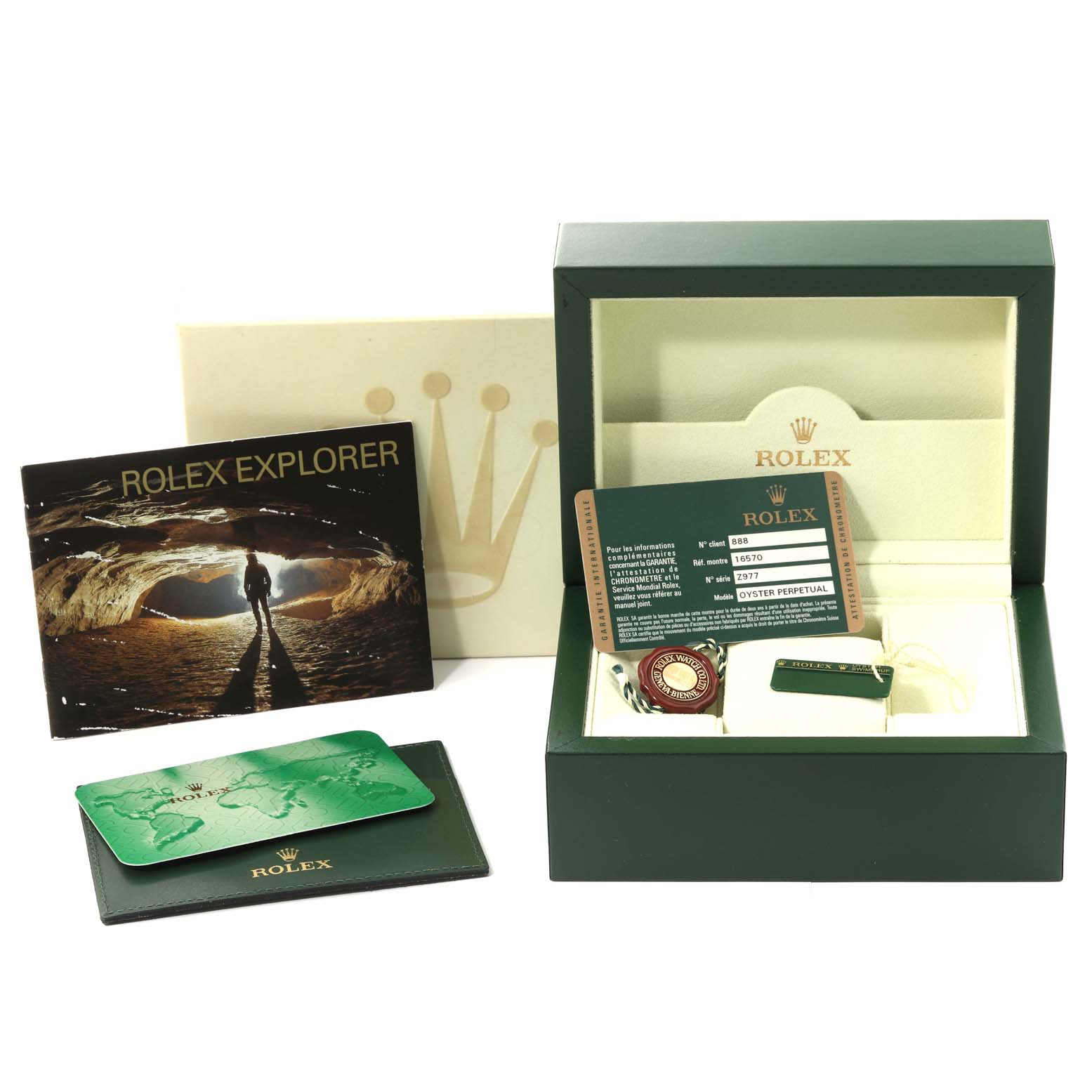 This image shows a complete set of Rolex Explorer 16570 Men's Stainless Steel Black Dial 16570 Men's Stainless Steel Black Dial accessories, including the box, booklet, warranty card, and tags.