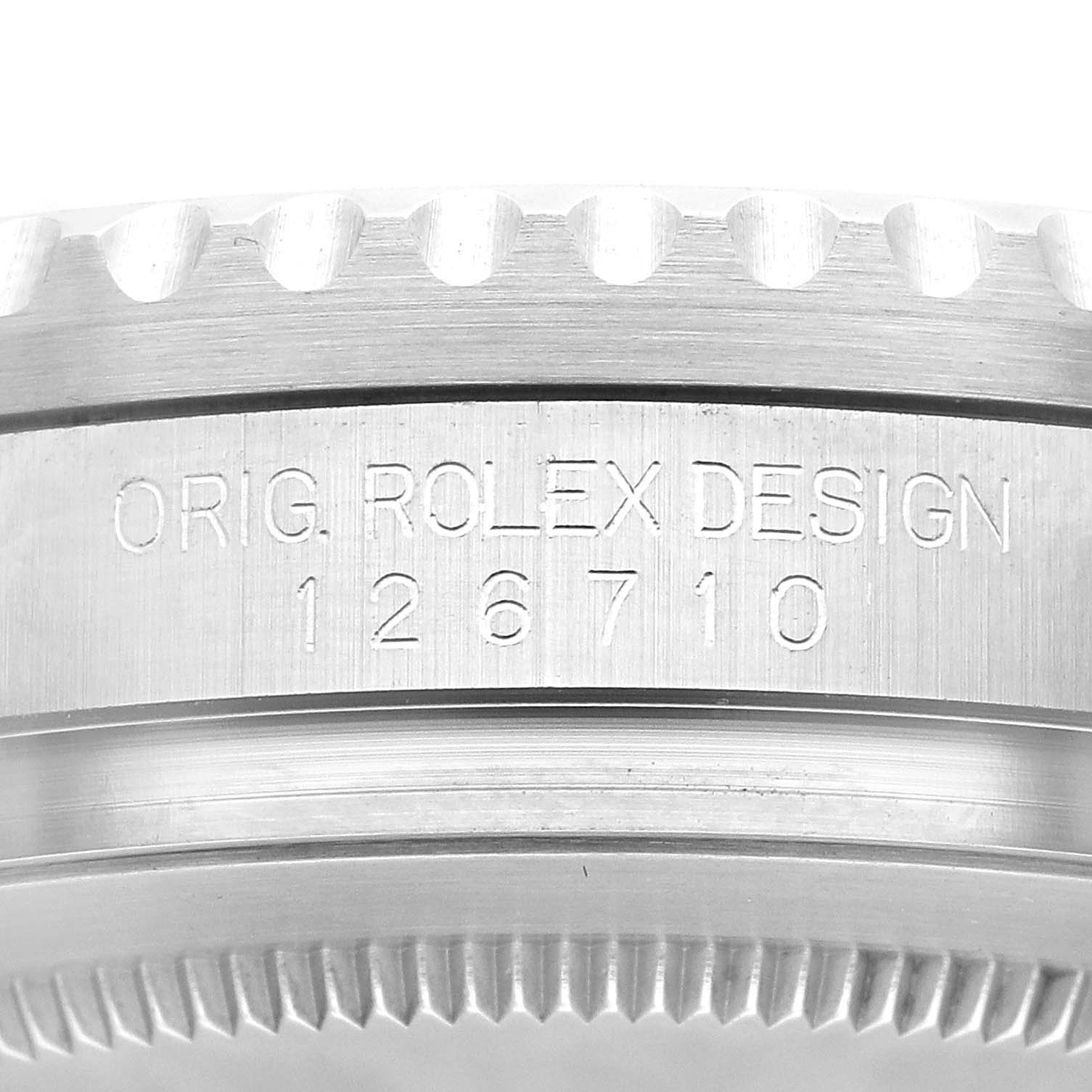 This image shows the side of a Rolex GMT-Master 126710BLNR Men's Stainless Steel Black Dial 126710BLNR Men's Stainless Steel Black Dial model watch with its design and reference number engraved.