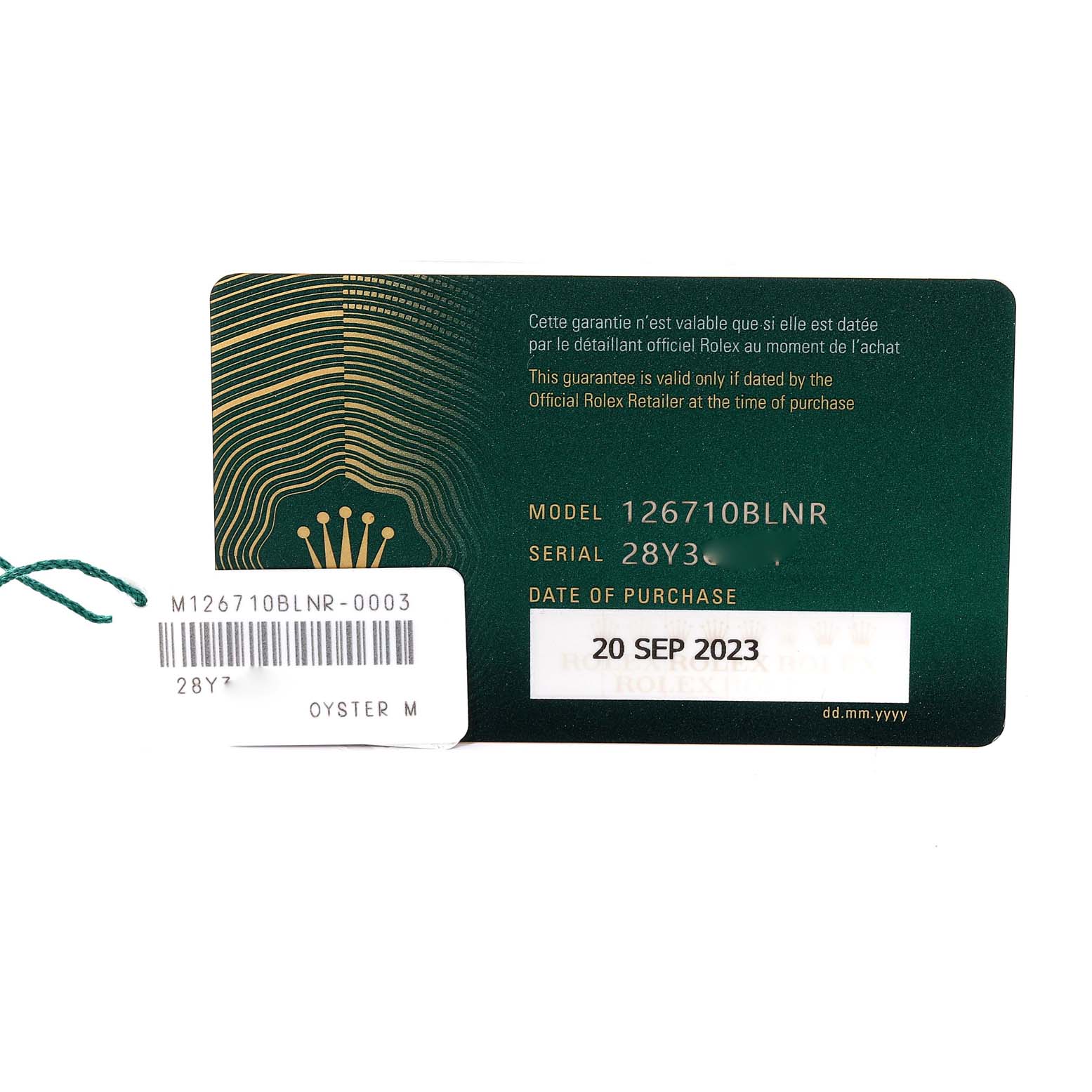 This image shows the warranty card and tag for the Rolex GMT-Master 126710BLNR Men's Stainless Steel Black Dial 126710BLNR Men's Stainless Steel Black Dial 126710BLNR.