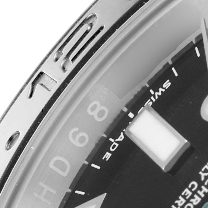 The image shows a close-up of the bezel and dial of a Rolex GMT-Master 116710 Men
s Stainless Steel Black Dial 116710 Men
s Stainless Steel Black Dial watch, highlighting the numbers and markers.