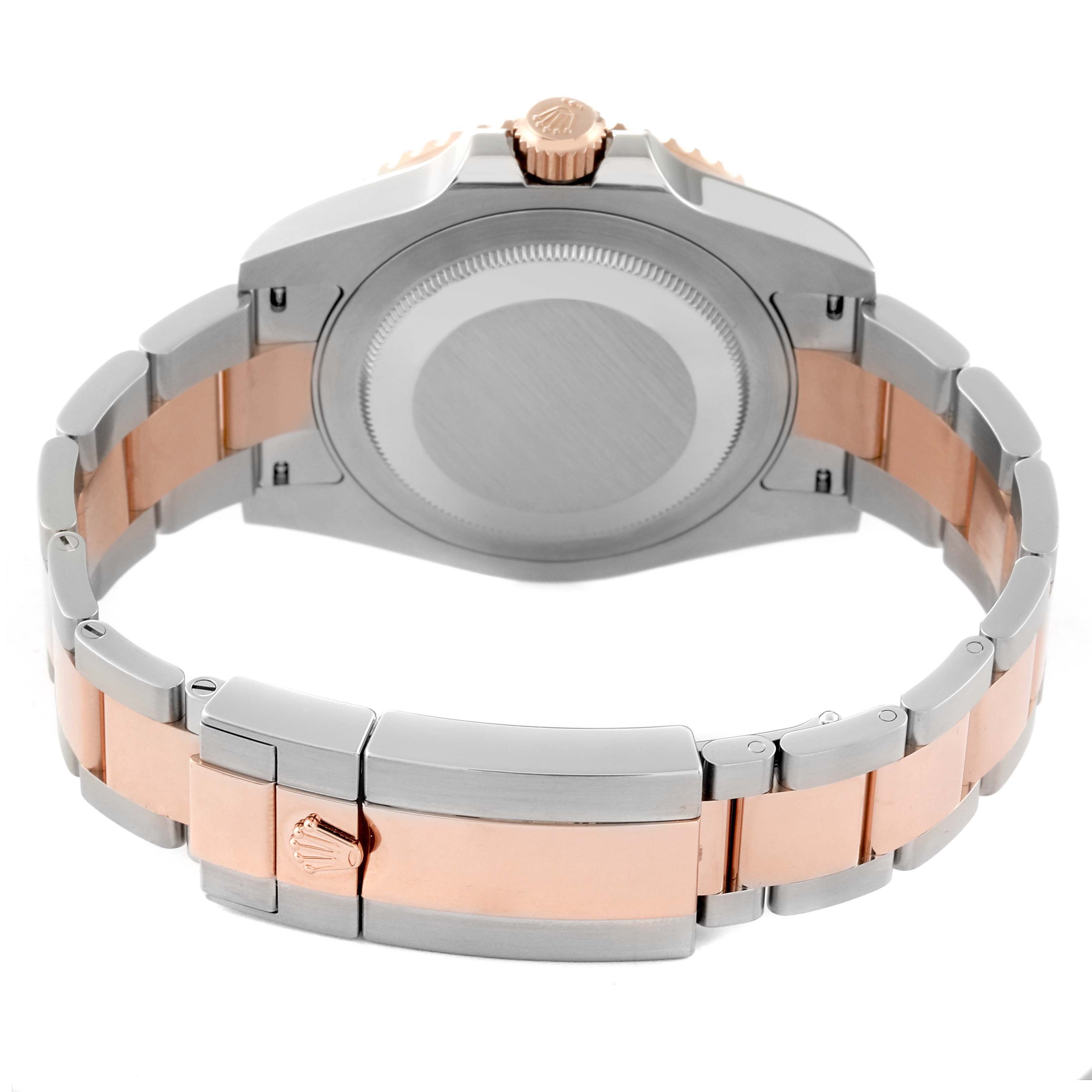 This is a rear view of a Rolex GMT-Master 126711CHNR Men's Steel and Gold (two tone) Black Dial 126711CHNR Men's Steel and Gold (two tone) Black Dial watch showing the case back, crown, and two-tone bracelet with the clasp open.