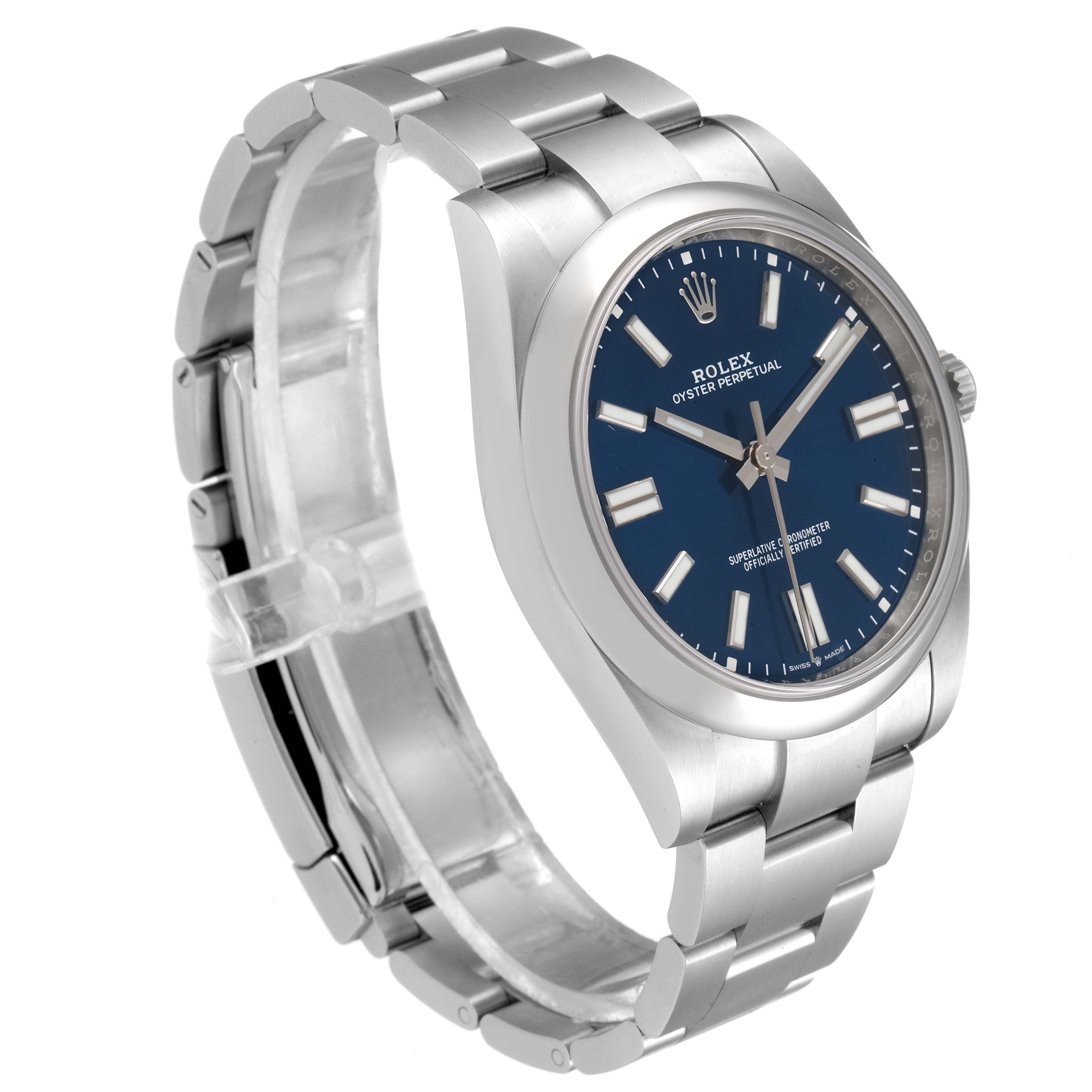 The image shows a Rolex Oyster Perpetual 124300 Men
s Stainless Steel Blue Dial 124300 Men
s Stainless Steel Blue Dial watch from a three-quarter angle, highlighting its blue dial and stainless steel bracelet.