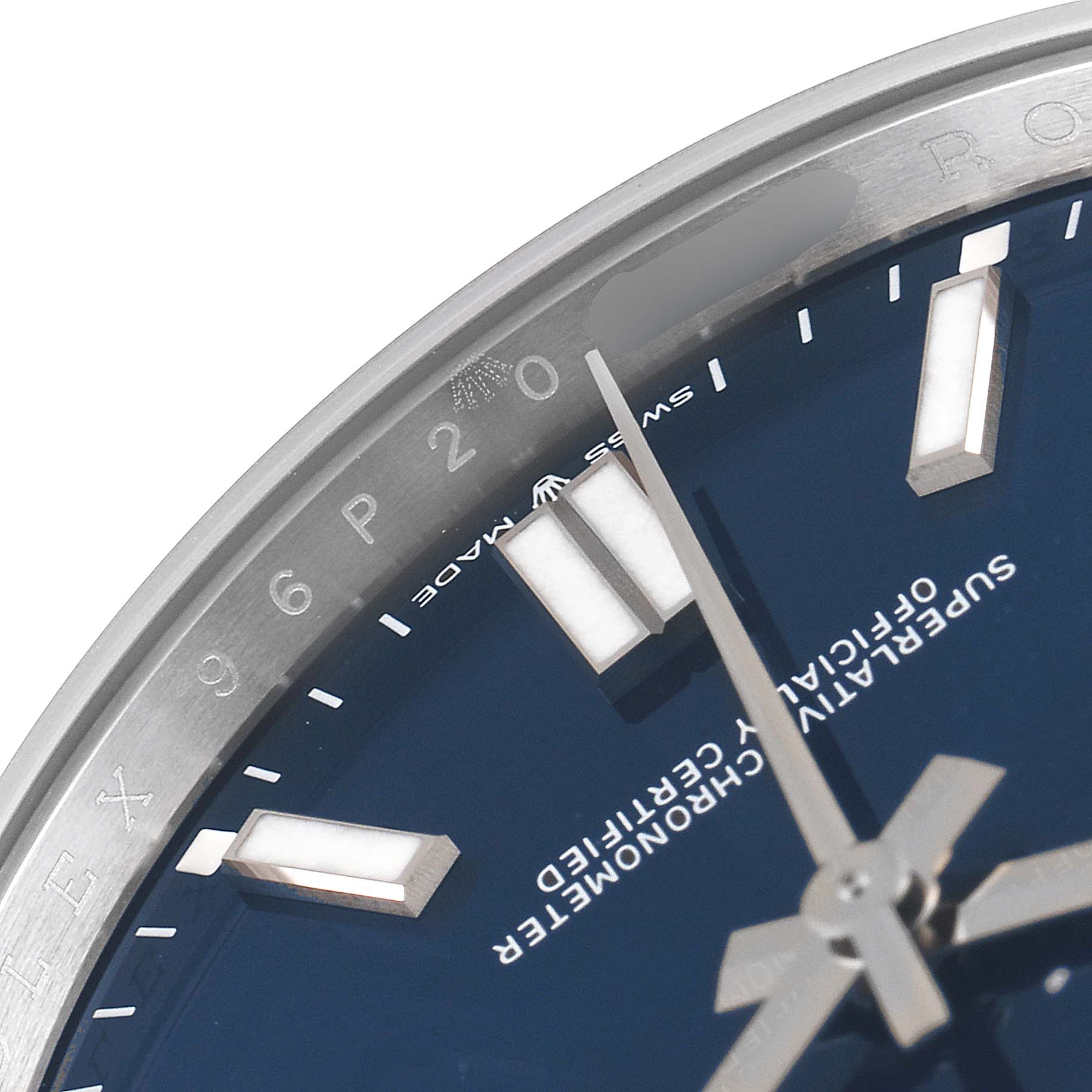 This close-up shows a partial view of the blue dial and markers of the Rolex Oyster Perpetual 124300 Men
s Stainless Steel Blue Dial 124300 Men
s Stainless Steel Blue Dial watch.