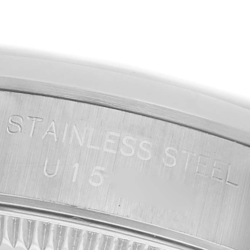 The image shows a close-up of the case back edge of a Rolex Oyster Perpetual 67180 Women's Stainless Steel Silver Dial 67180 Women's Stainless Steel Silver Dial, highlighting the engraving.