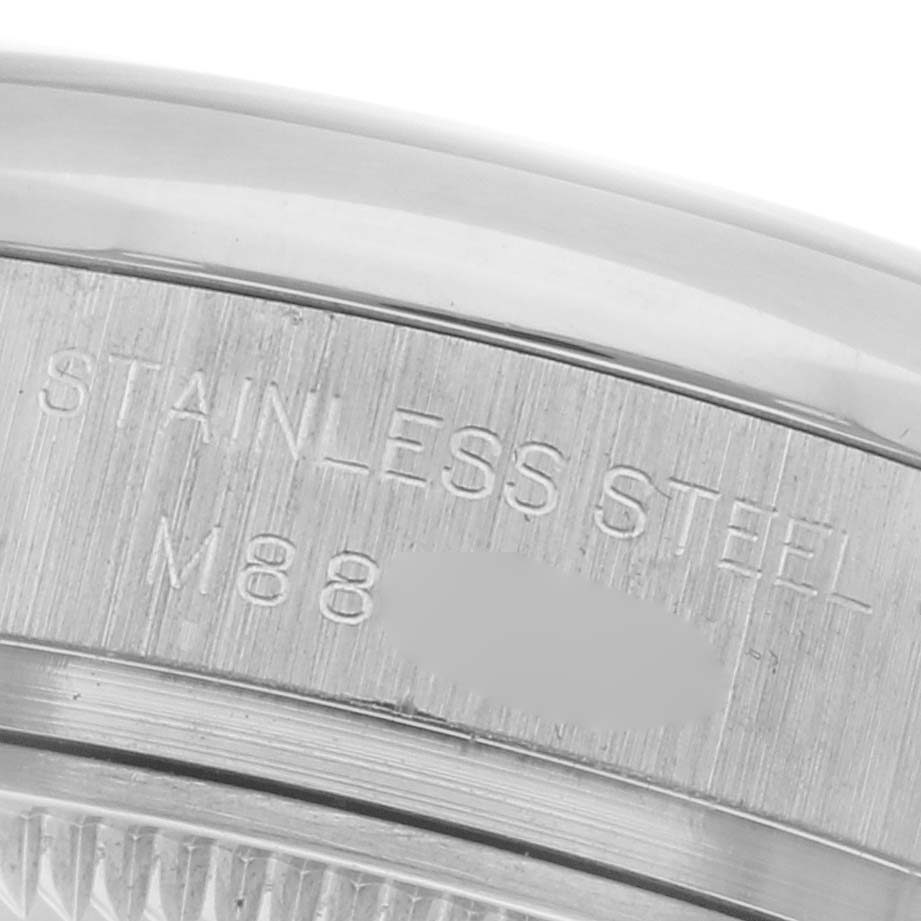 The image shows a close-up of the stainless steel back of a Rolex Oyster Perpetual 176200 Women's Stainless Steel Silver Dial 176200 Women's Stainless Steel Silver Dial watch.