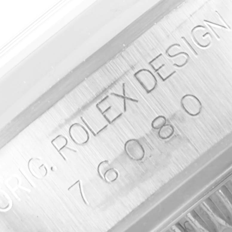 The image shows a close-up of the case side of a Rolex Oyster Perpetual 76080 Women's Stainless Steel Pink Dial 76080 Women's Stainless Steel Pink Dial, displaying the "ORIG. ROLEX DESIGN" engraving and model number.