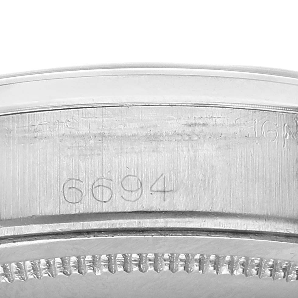 The image shows a close-up of the side of a Vintage Collection Rolex watch, focusing on the engraved model number "6694."
