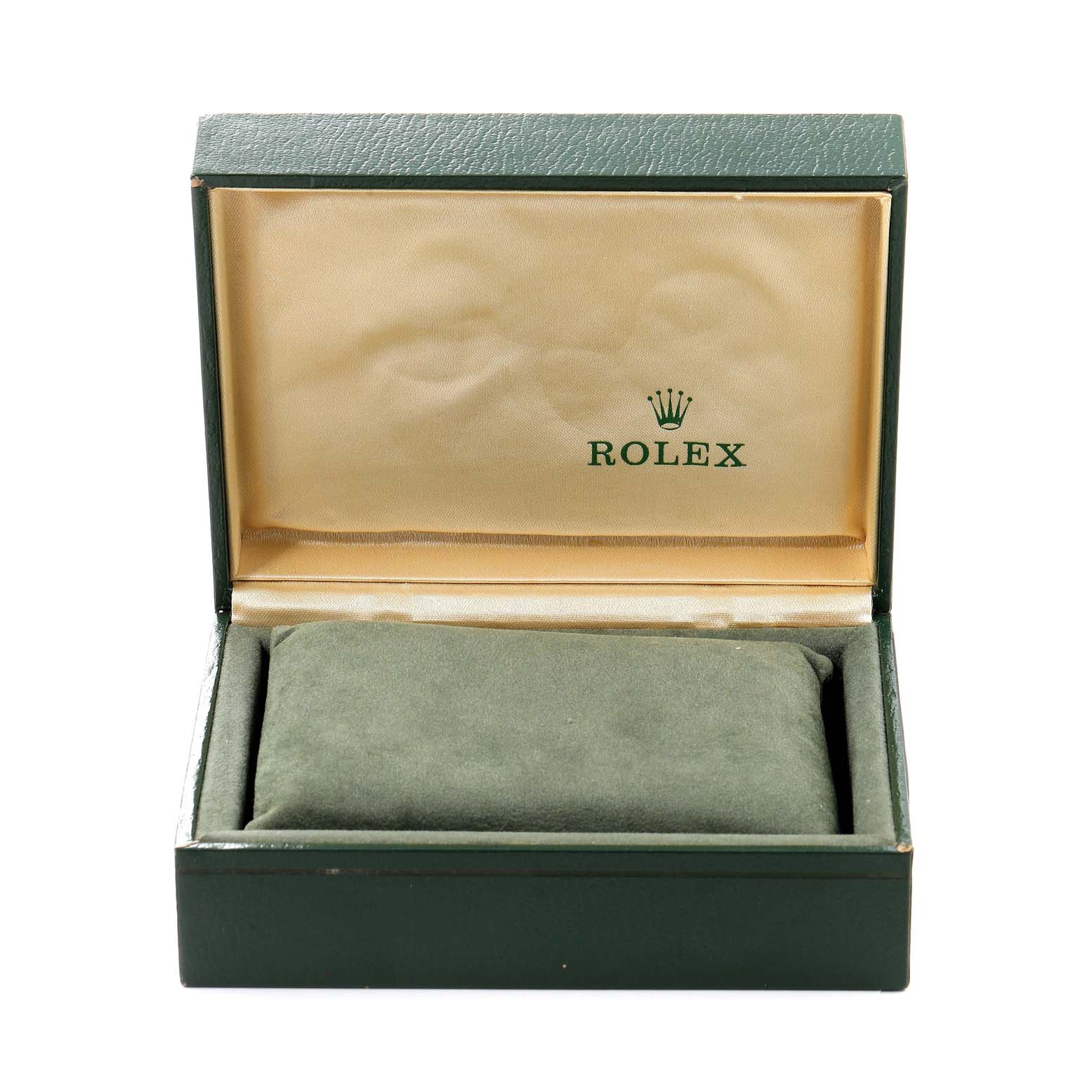 The image shows an open Rolex watch box for the Vintage Collection model, featuring its green and beige interior.