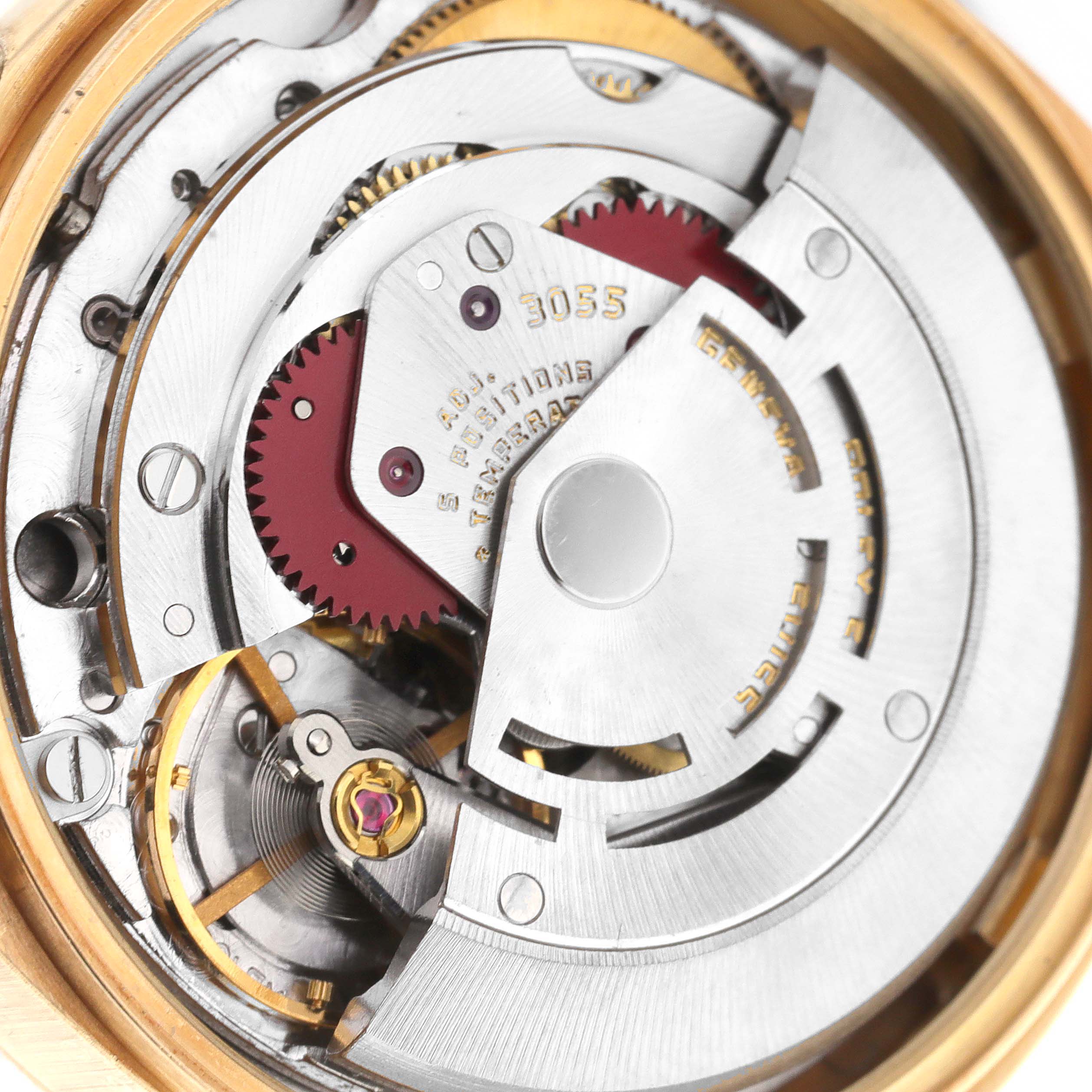 The image shows the internal movement of a Rolex President 18078 Men's Yellow Gold Silver Dial 18078 Men's Yellow Gold Silver Dial model watch, focusing on its intricate gears and mechanisms.