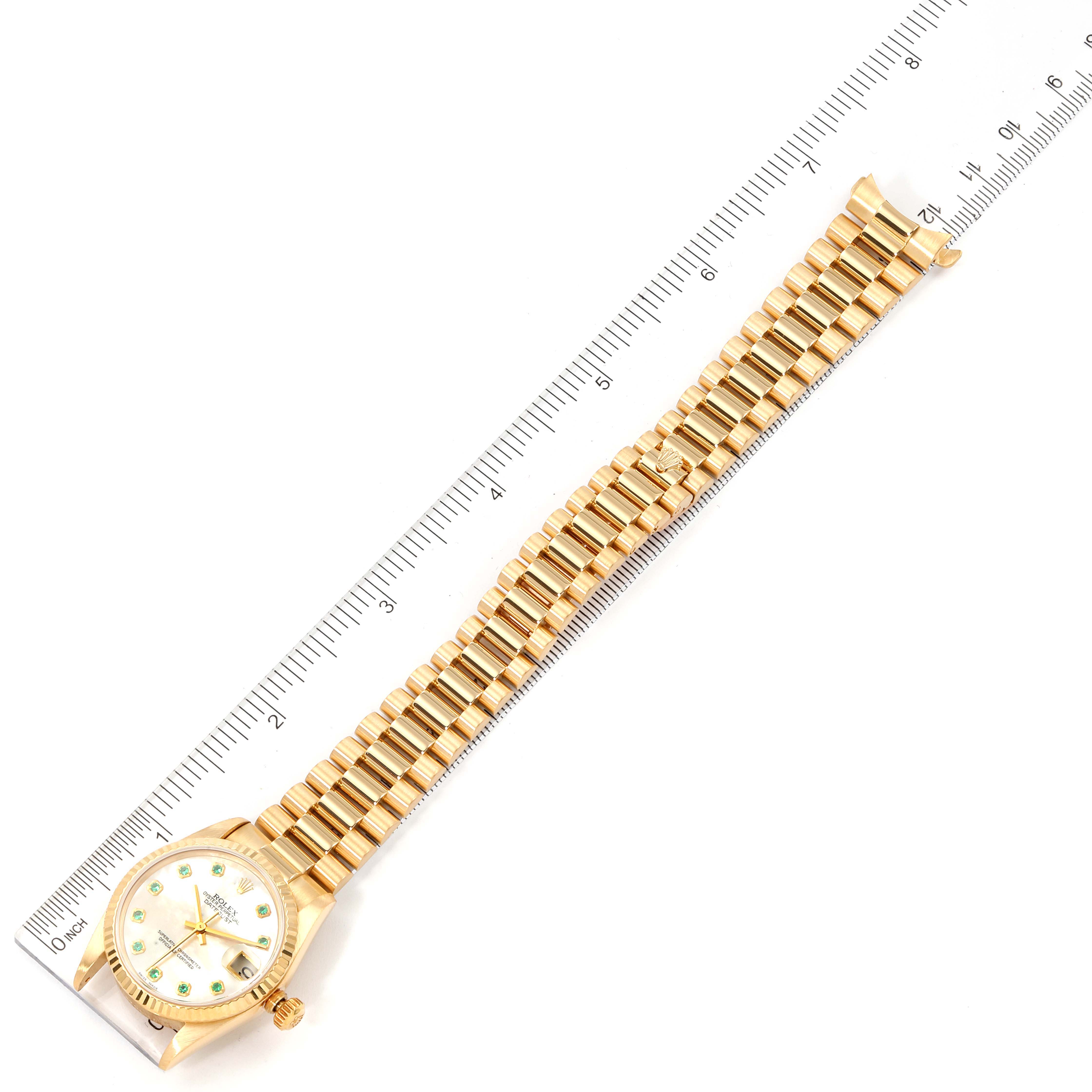 The Rolex President 78278 Women
s Yellow Gold Mother of Pearl Dial 78278 Women
s Yellow Gold Mother of Pearl Dial model watch is displayed flat, showing the full face, band, and a ruler for scale.