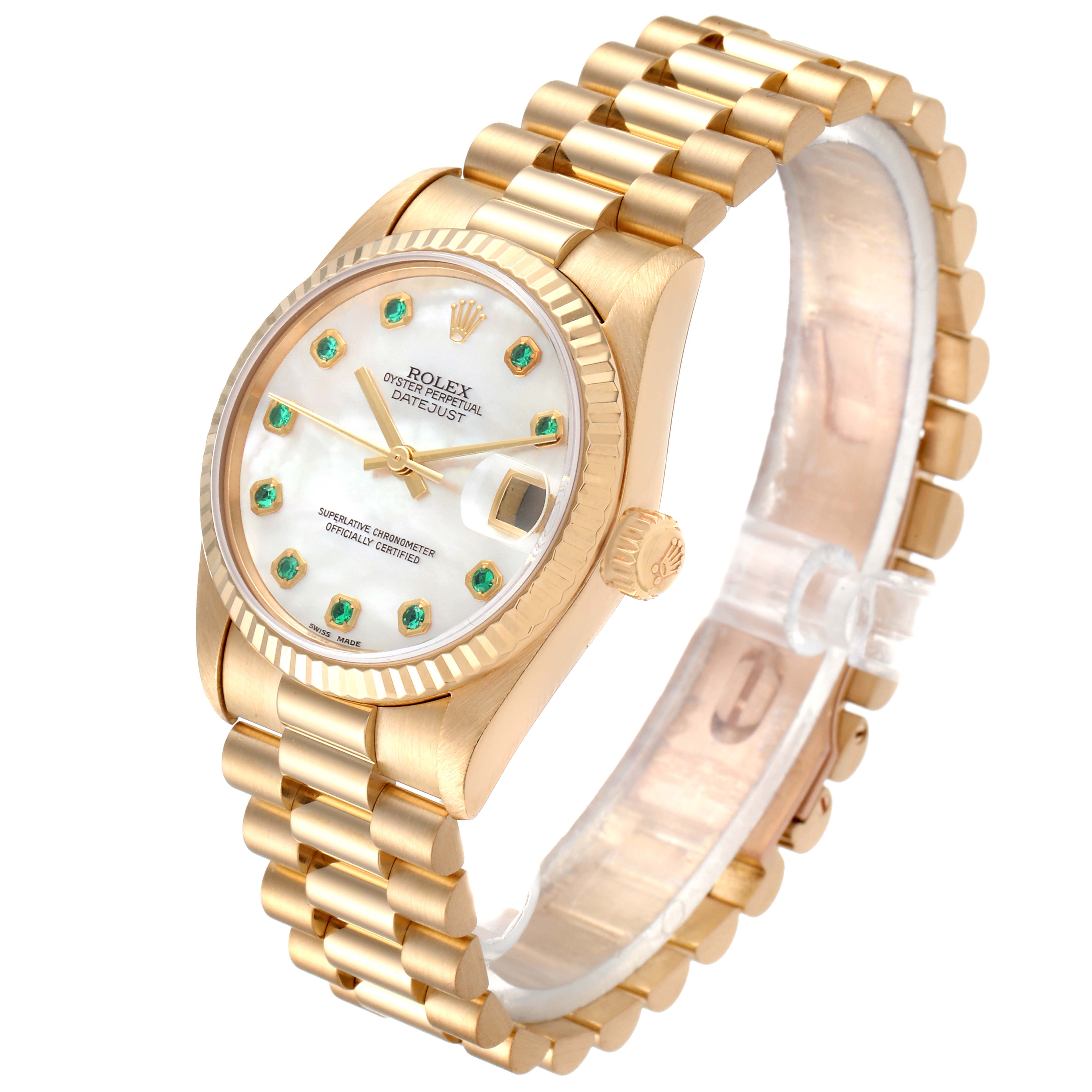 This image shows a Rolex President 78278 Women
s Yellow Gold Mother of Pearl Dial 78278 Women
s Yellow Gold Mother of Pearl Dial model watch at a slight angle, highlighting its gold bracelet, crown, and dial with green emerald markers.