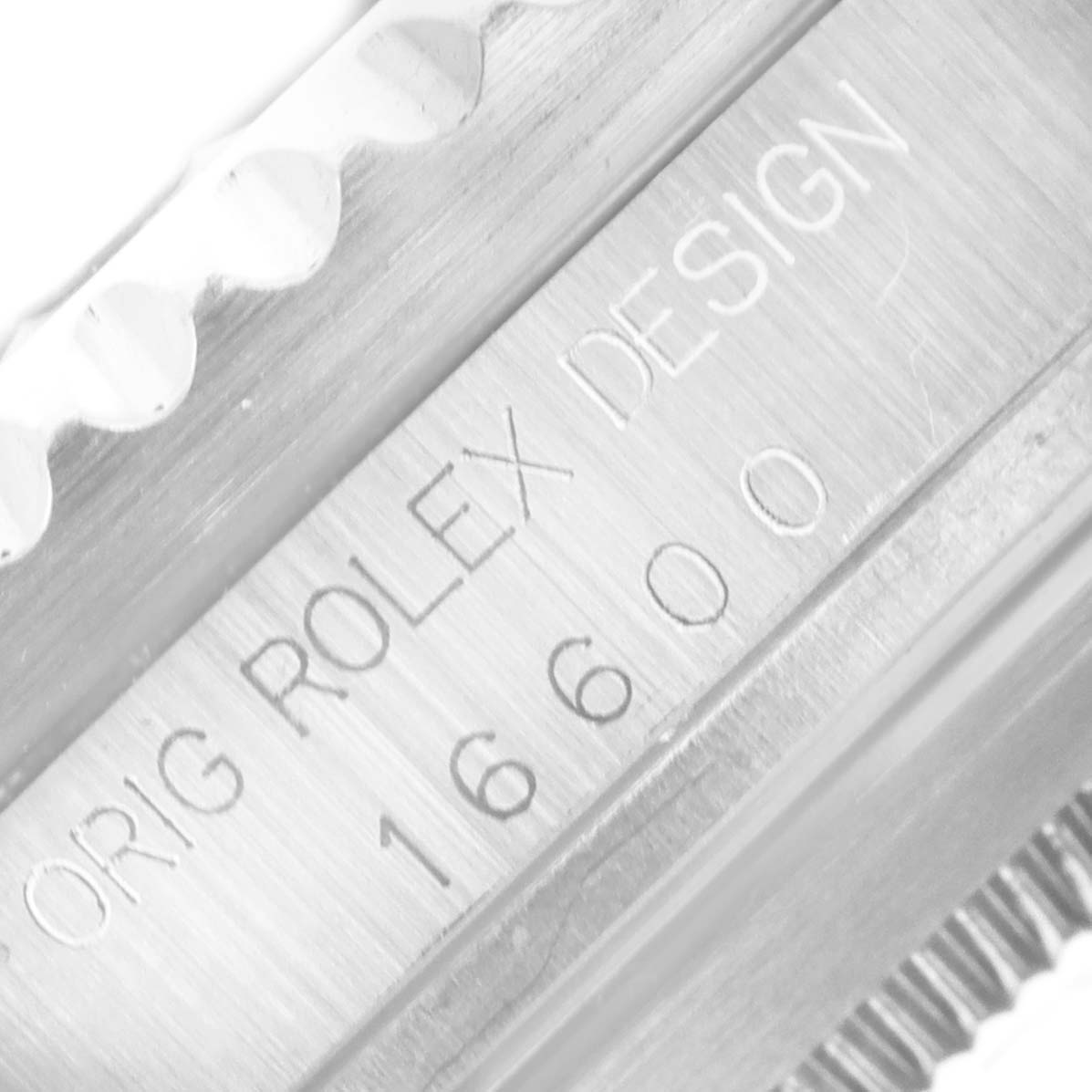 This image shows a close-up of the model number and design engraving on the side of the Rolex Sea-Dweller 16600 Men
s Stainless Steel Black Dial 16600 Men
s Stainless Steel Black Dial watch case.