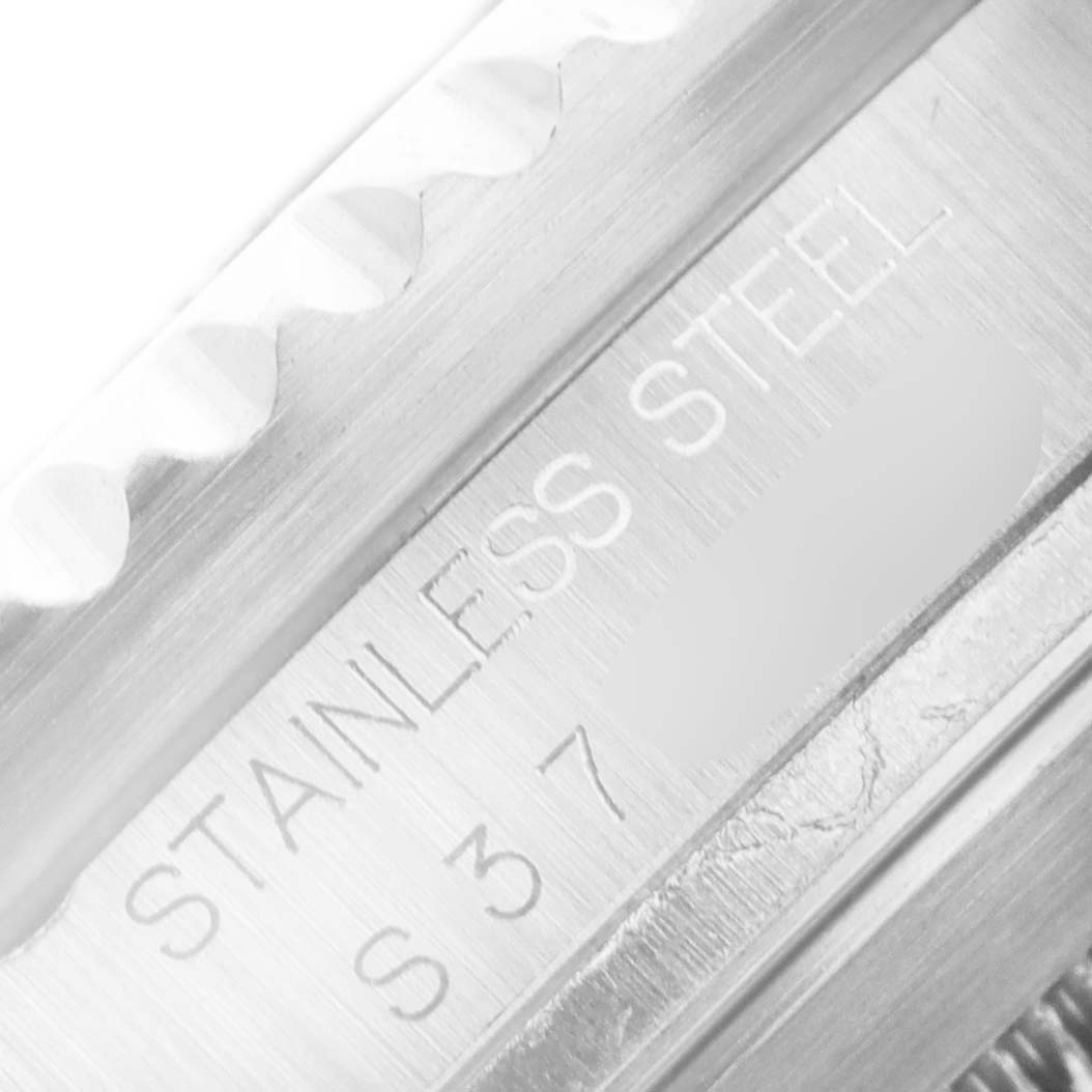 The image shows a close-up angle of the stainless steel outer bezel with engravings on a Rolex Sea-Dweller 16600 Men
s Stainless Steel Black Dial 16600 Men
s Stainless Steel Black Dial watch.