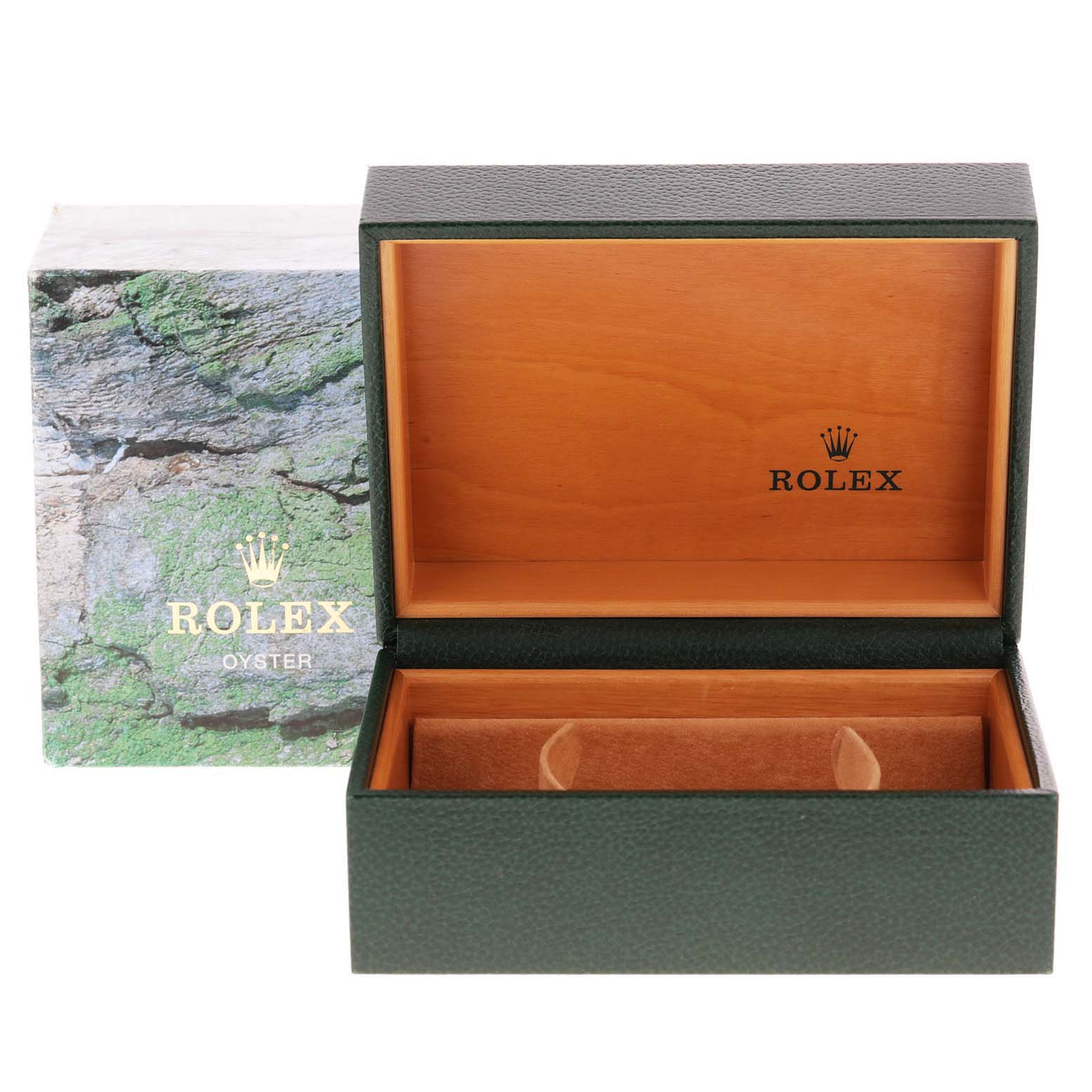 The image shows an open Rolex Oyster Sea-Dweller watch box with the lid raised, revealing a cushioned interior for the watch.