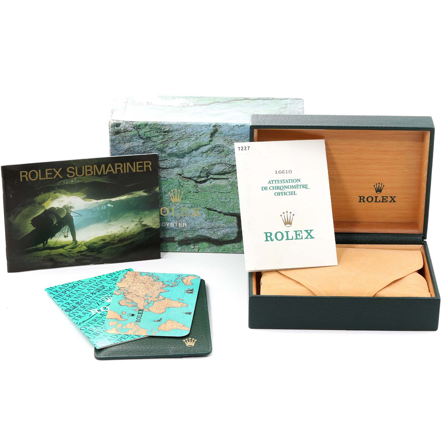 The image shows the packaging, manuals, and accessories for the Rolex Submariner 16610 Men
s Stainless Steel Black Dial 16610 Men
s Stainless Steel Black Dial model, including a box, booklet, and warranty card.