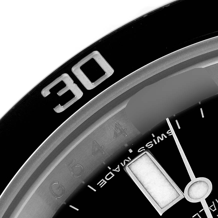 The image shows a close-up of the bezel and part of the dial of a Rolex Submariner 116610 Men
s Stainless Steel Black Dial 116610 Men
s Stainless Steel Black Dial watch, featuring the "30" marking.