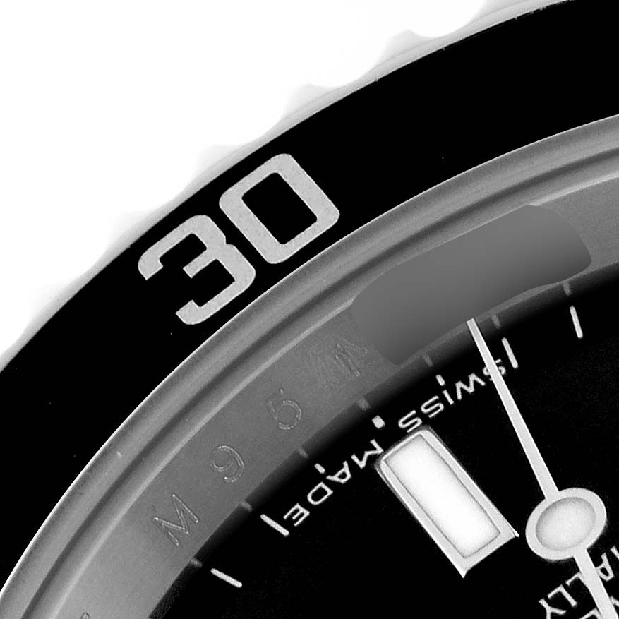 This close-up angle shows the bezel and a portion of the dial on a Rolex Submariner 14060M Men
s Stainless Steel Black Dial 14060M Men
s Stainless Steel Black Dial watch.