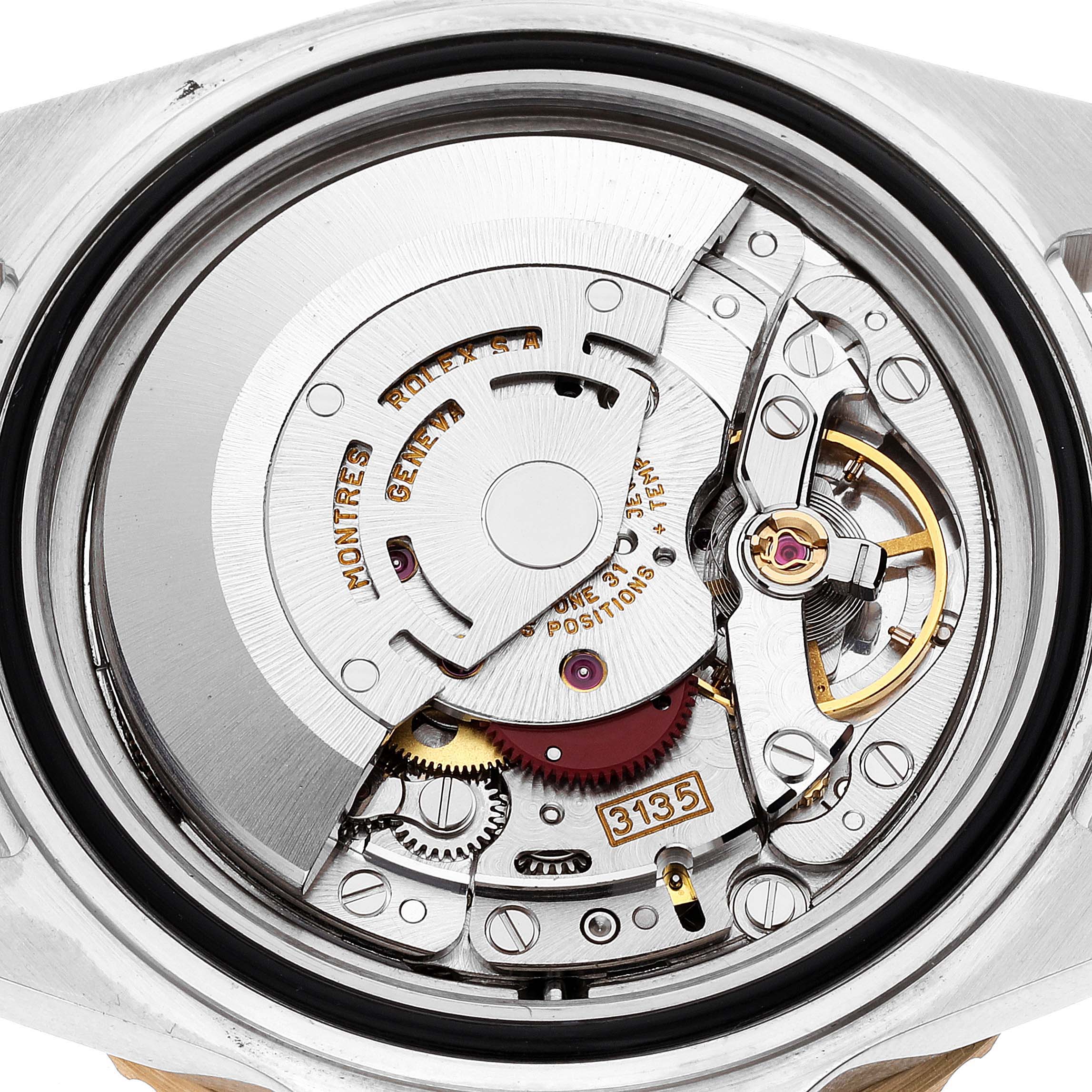 The image shows the internal movement mechanism of a Rolex Submariner 16613 Men's Steel and Gold (two tone) Champagne Dial 16613 Men's Steel and Gold (two tone) Champagne Dial watch from a back angle.