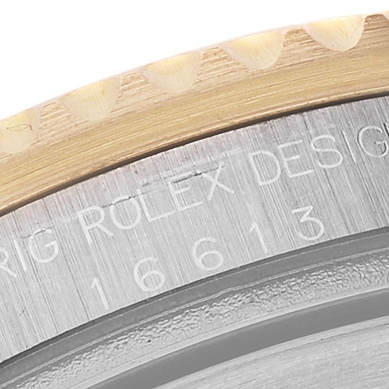 This image shows a close-up of the bezel and case with engravings on the Rolex Submariner 16613 Men's Steel and Gold (two tone) Champagne Dial 16613 Men's Steel and Gold (two tone) Champagne Dial model.