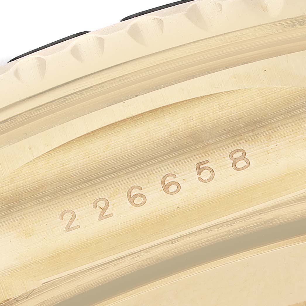 The image shows a close-up of the case edge of a Rolex Yacht-Master 226658 Men's Yellow Gold Beige Dial, highlighting the engraved serial number.
