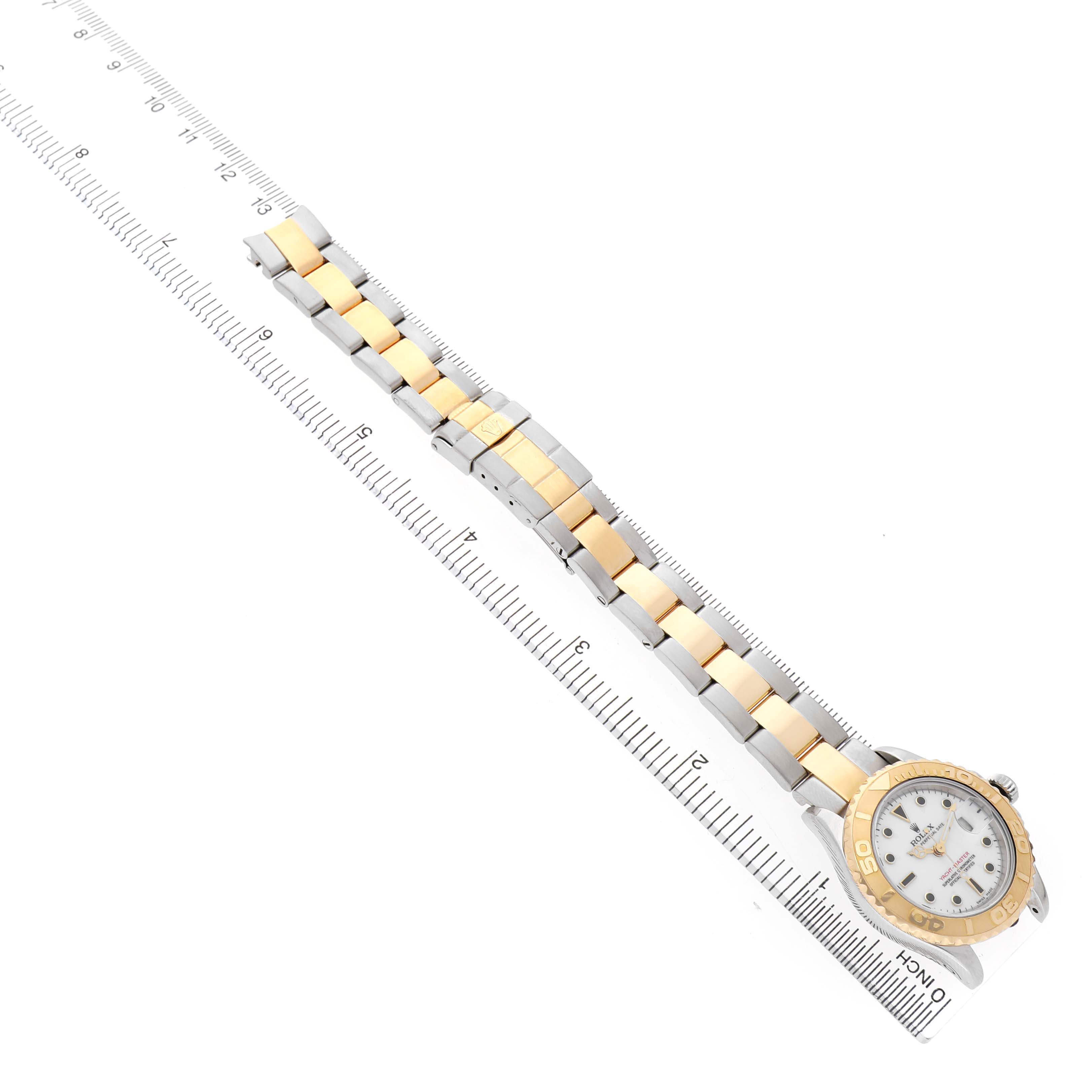 The Rolex Yacht-Master 169623 Women's Steel and Gold (two tone) White Dial watch is shown at a diagonal angle, highlighting the bracelet and face with a gold and silver design.