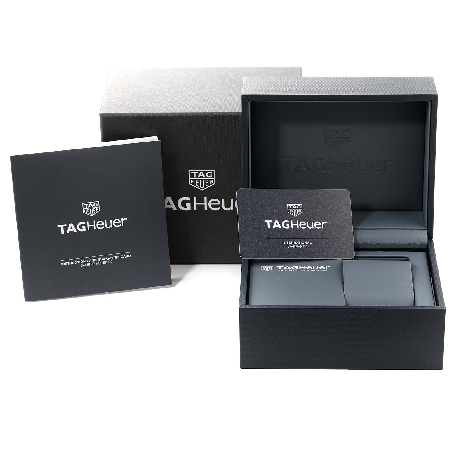 The image shows the packaging, instruction manual, and warranty card for the Tag Heuer Carrera CBG2A10.BA0654 Men's Stainless Steel  CBG2A10.BA0654 Men's Stainless Steel  model.