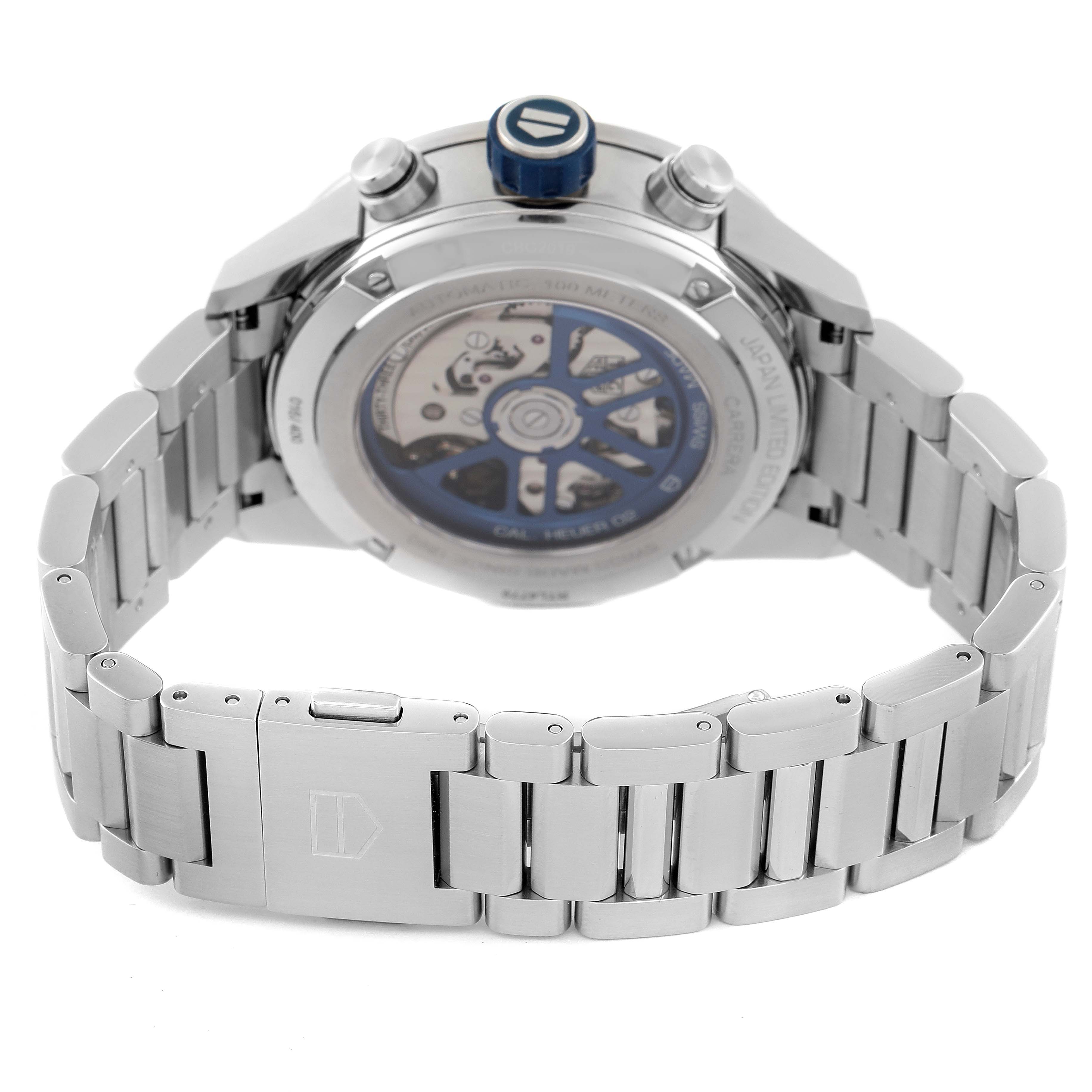 The image shows the back view of the Tag Heuer Carrera watch, highlighting its transparent case back and stainless steel bracelet.