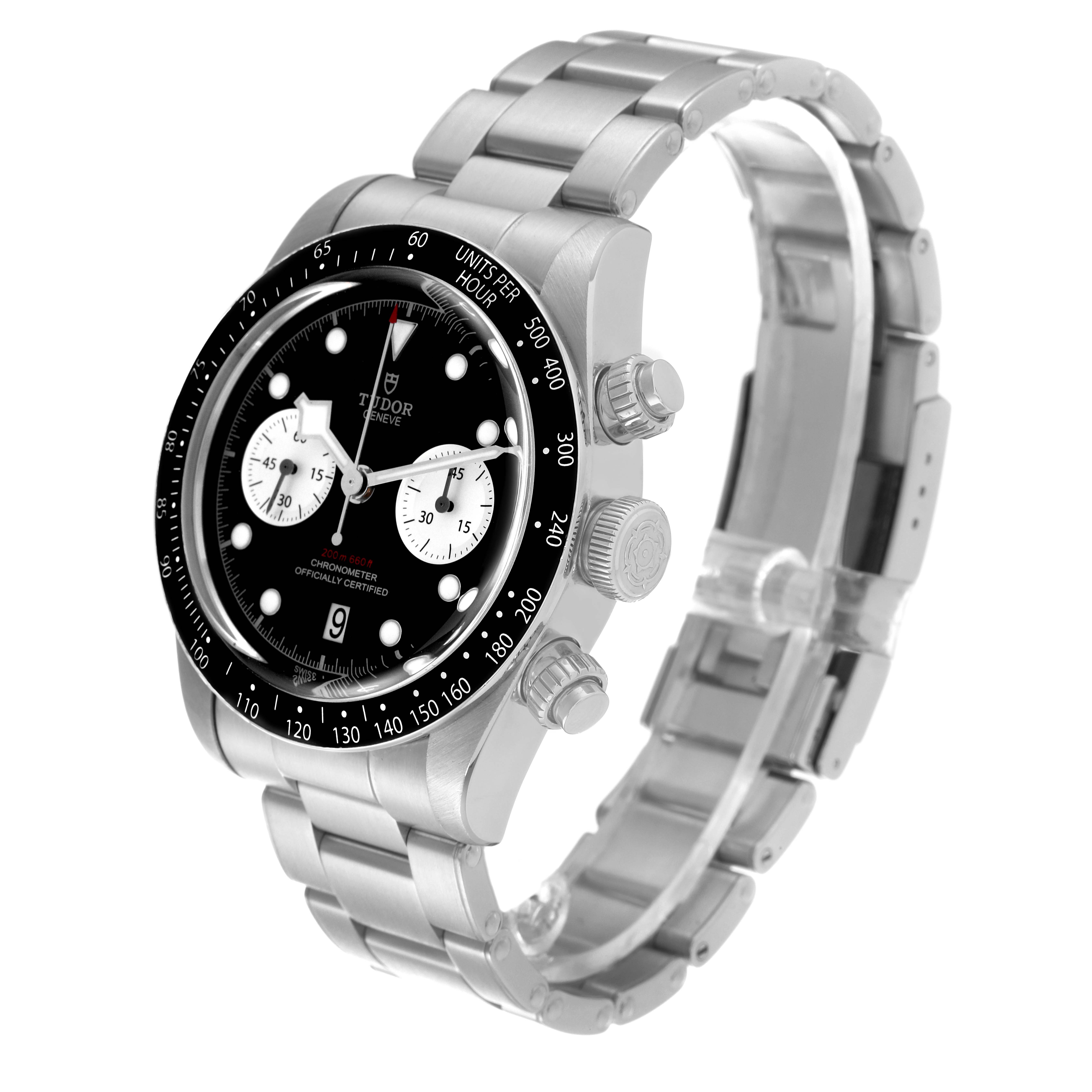 The image shows a Tudor Sport Chronograph watch from a three-quarter angle, highlighting its stainless steel band and detailed face.