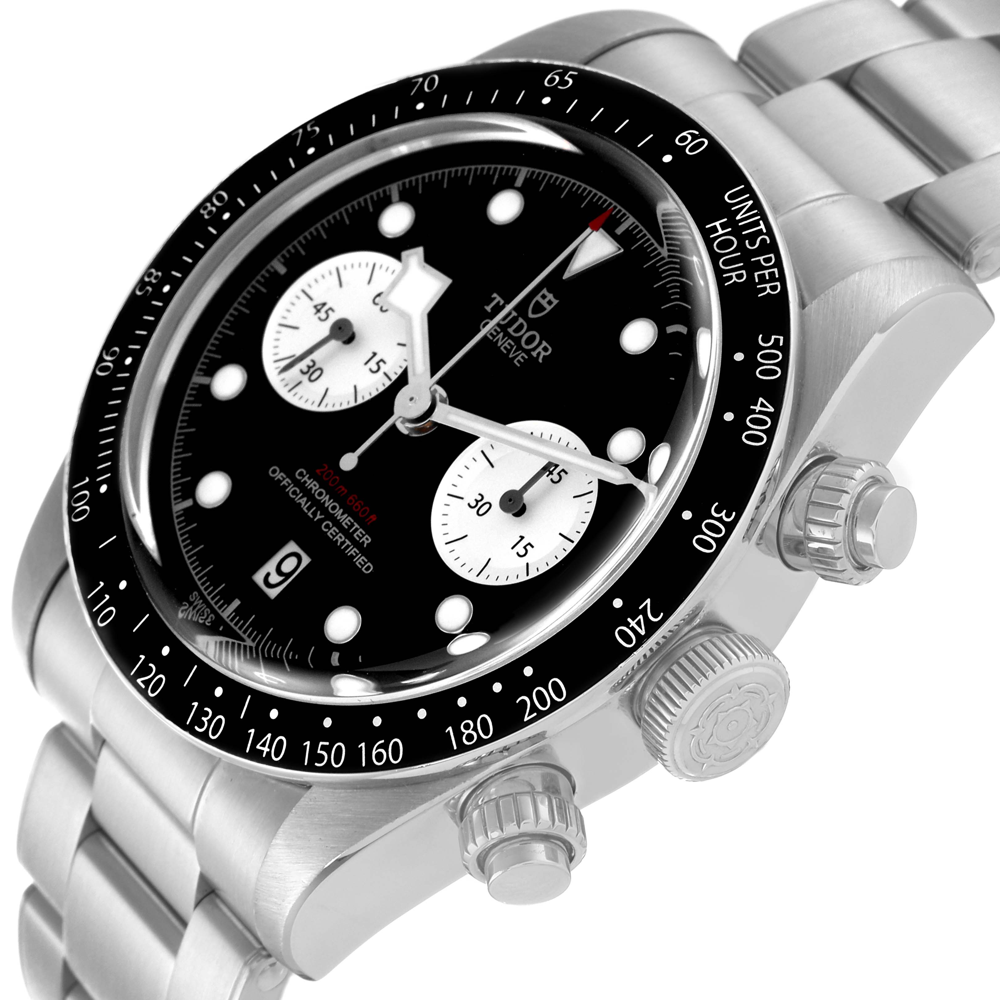 The Tudor Sport Chronograph watch is shown at a slight angle, displaying the face, bezel, and side buttons.