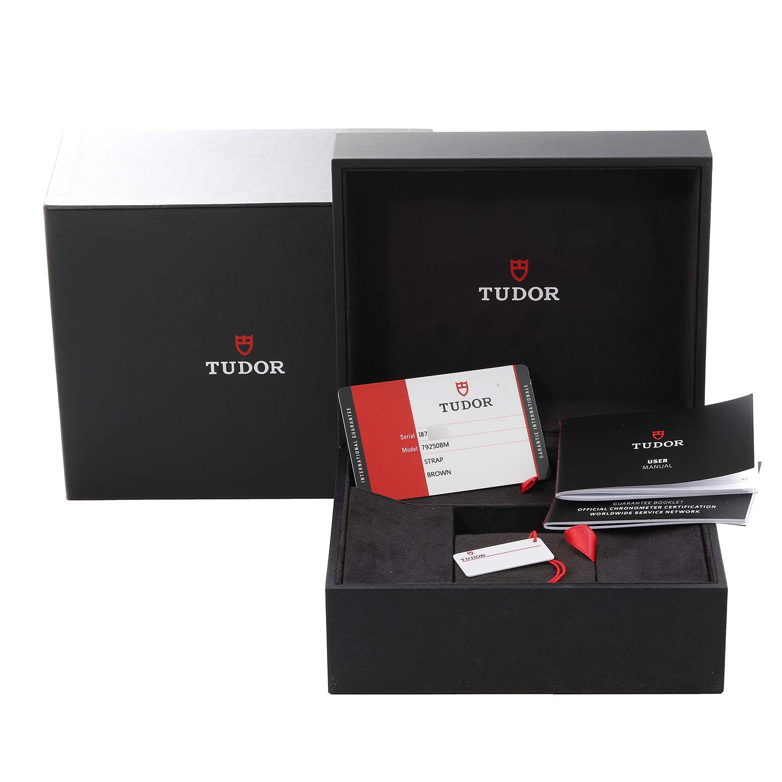 The image shows the packaging and accessories for the Tudor Heritage Black Bay 79250B Men's Bronze Brown Dial 79250B Men's Bronze Brown Dial watch, including the box, warranty card, and user manual.