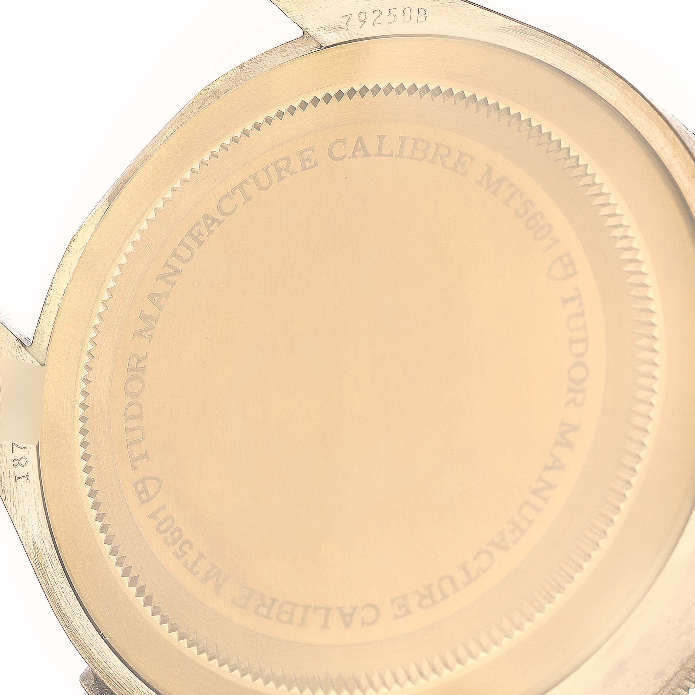 This image shows the engraved back case of a Tudor Heritage Black Bay 79250B Men's Bronze Brown Dial 79250B Men's Bronze Brown Dial watch, viewed from a top angle.